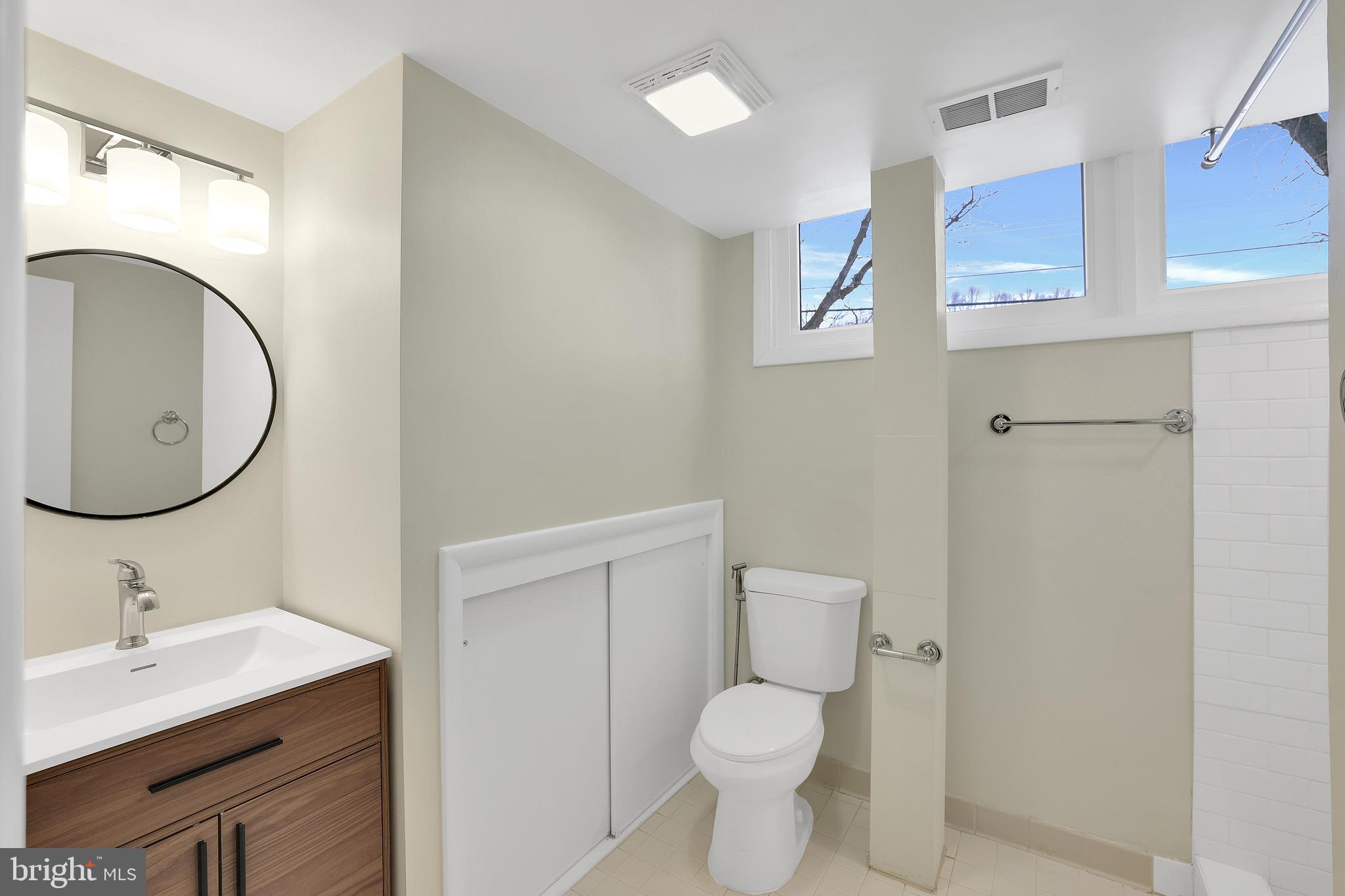 6718 Old Chesterbrook Road McLean, VA 22101 - Photo 18 of 38 a bathroom with a sink and a mirror