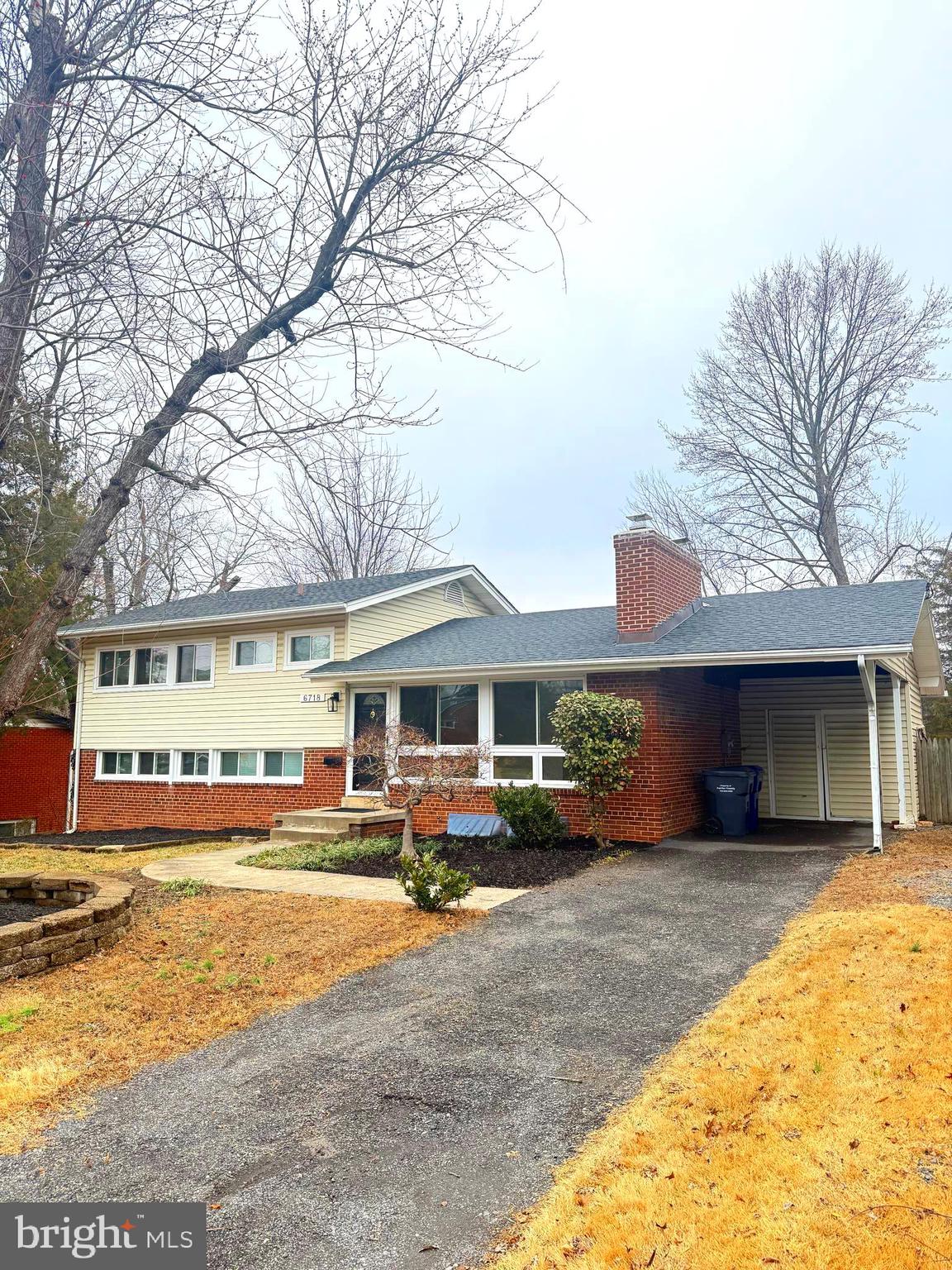 6718 Old Chesterbrook Road McLean, VA 22101 - Photo 2 of 38 a front view of a building with garden