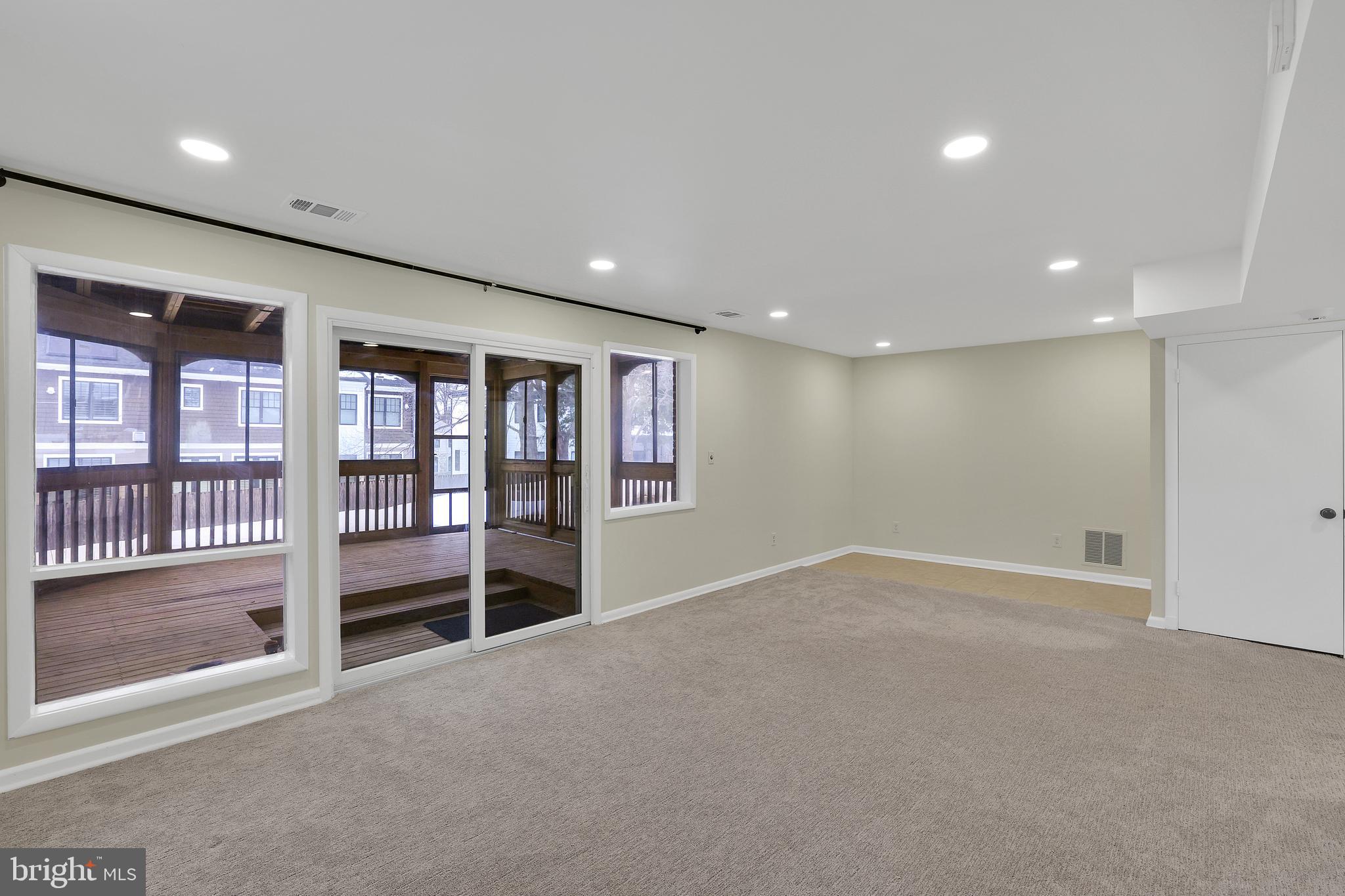 6718 Old Chesterbrook Road McLean, VA 22101 - Photo 28 of 38 an empty room with wooden floor and windows