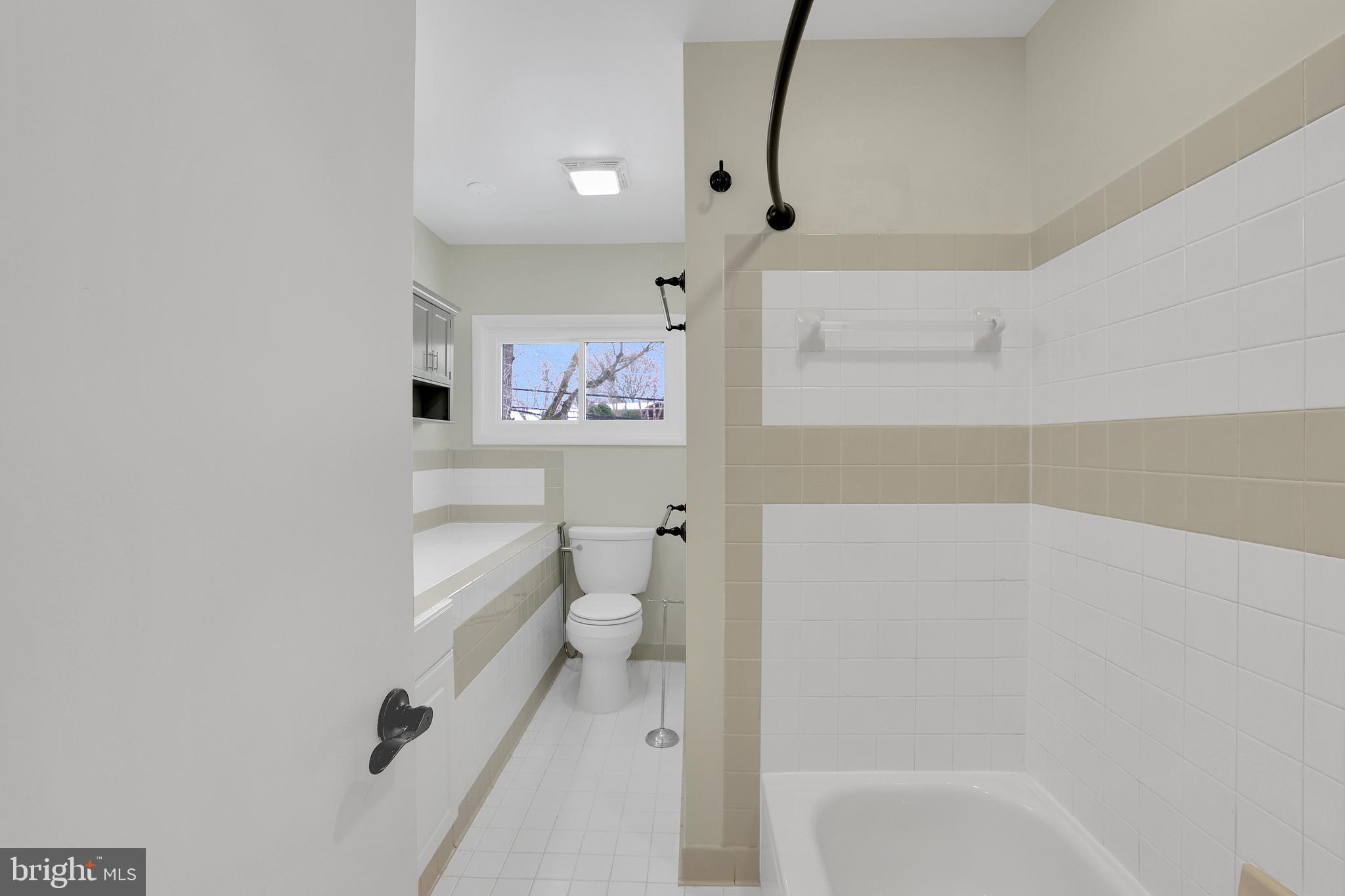 6718 Old Chesterbrook Road McLean, VA 22101 - Photo 10 of 38 a bathroom with a toilet and a shower