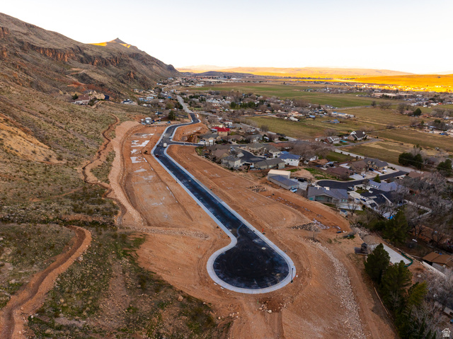 1087 South 160 West Hurricane, UT 84737 - Photo 3 of 4 New development featuring paved roads with concrete curbing, graded lots, and mountain scenery