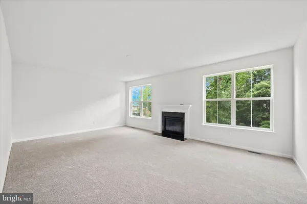a view of a livingroom with fireplace