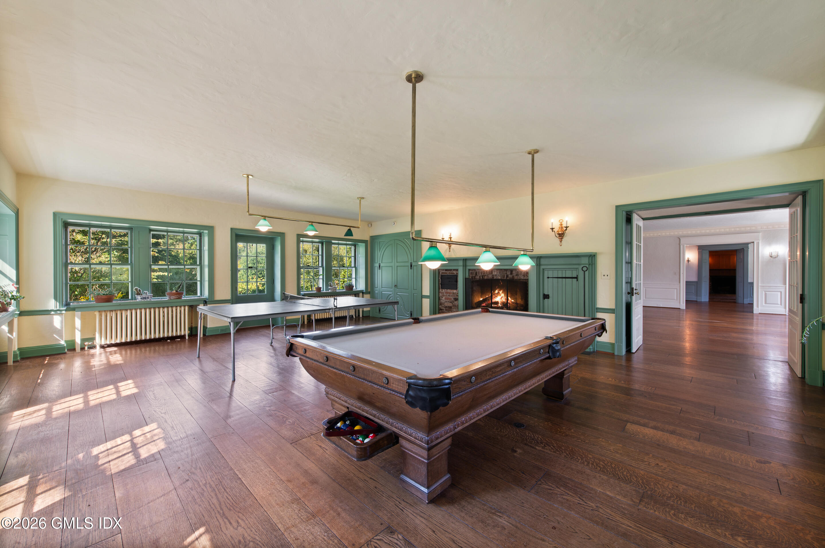 122 Round Hill Road Greenwich, CT 06831 - Photo 9 of 37 a room with pool table and glass door