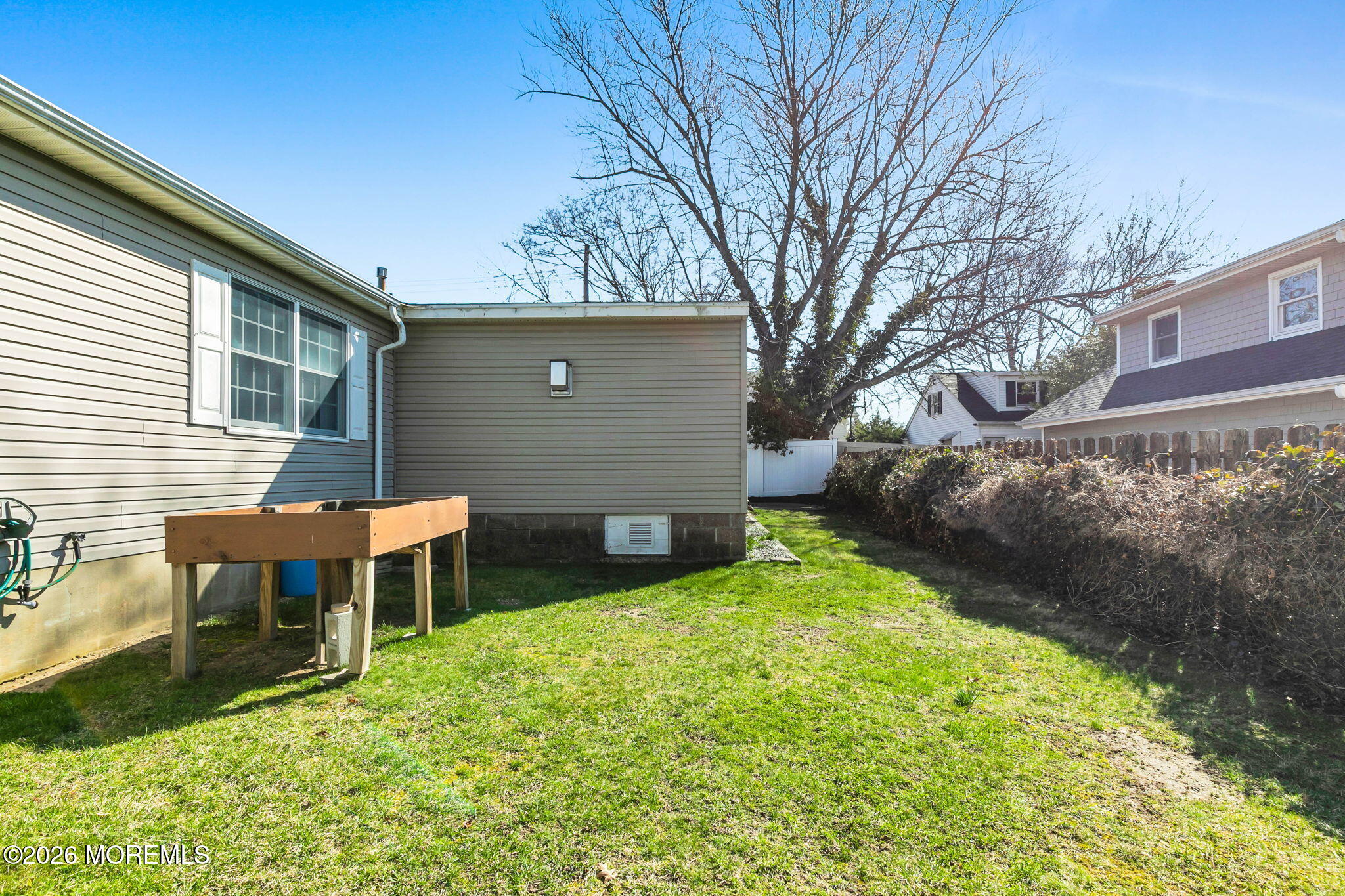 12 S Road Monmouth Beach, NJ 07750 - Photo 18 of 19 a backyard of a house with table and chairs