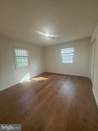 a view of empty room with windows