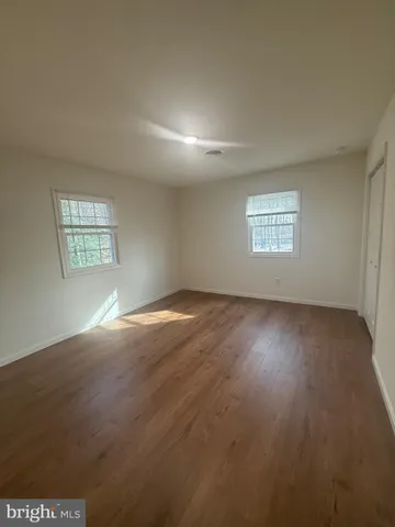 a view of empty room with windows
