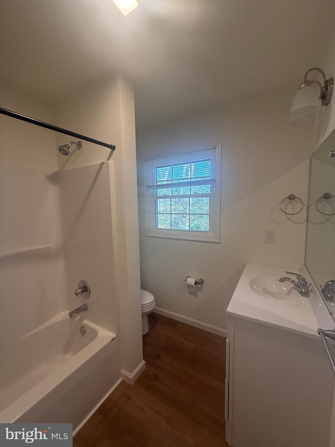 8859 Clendaniel Pond Road Lincoln, DE 19960 - Photo 20 of 25 a bathroom with a sink a toilet and shower