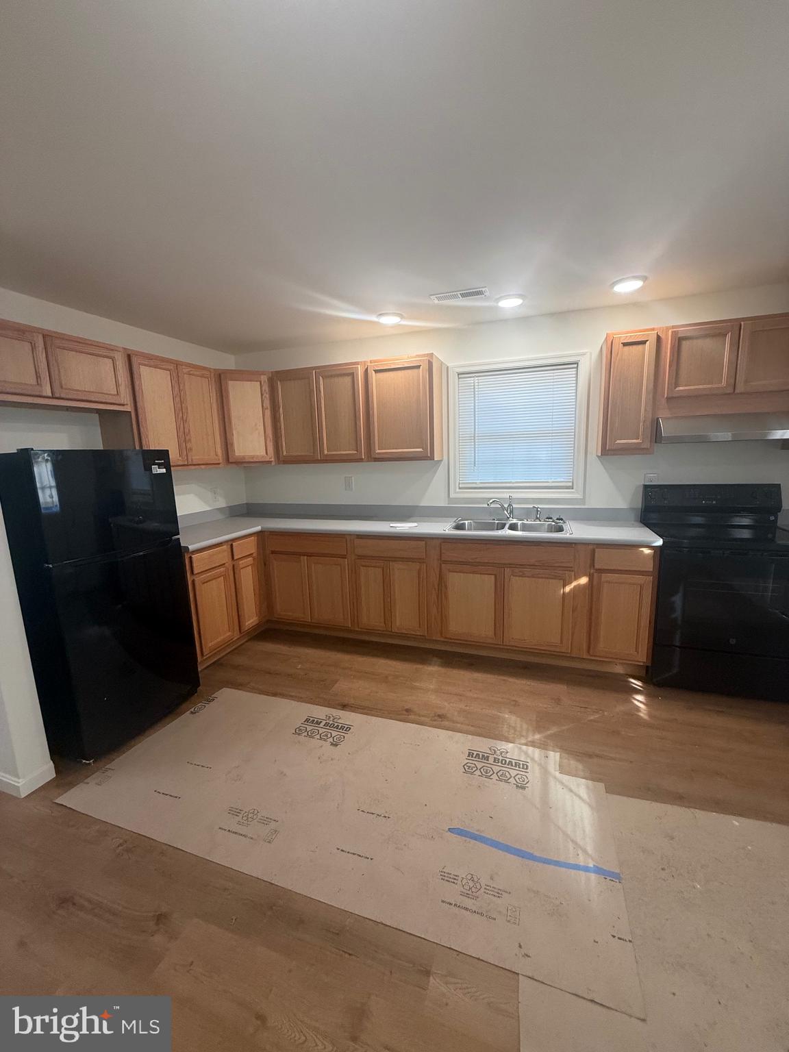 8859 Clendaniel Pond Road Lincoln, DE 19960 - Photo 8 of 25 a view of a kitchen with a sink