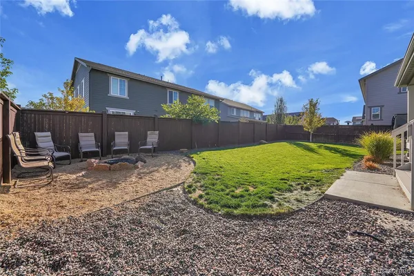 a view of a chairs and tables in the balcony