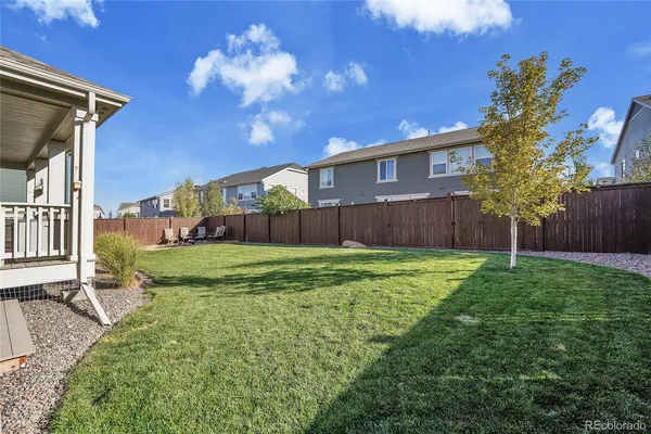 a view of a house with backyard porch and sitting area