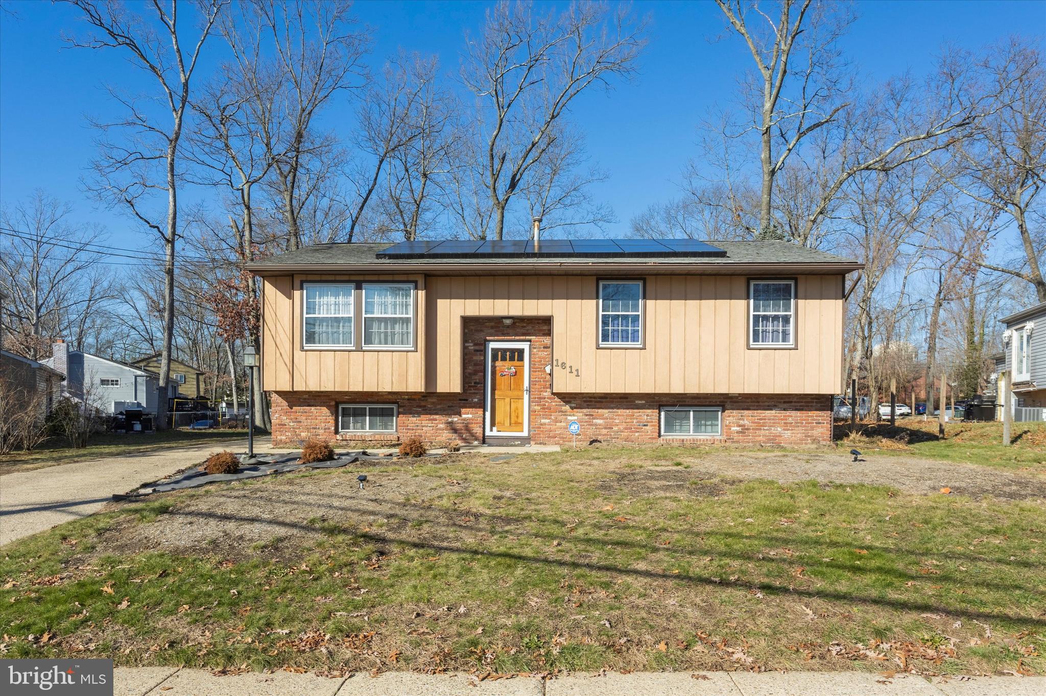 1611 Forest Drive Williamstown, NJ 08094 - Photo 1 of 31 a front view of a house with garden