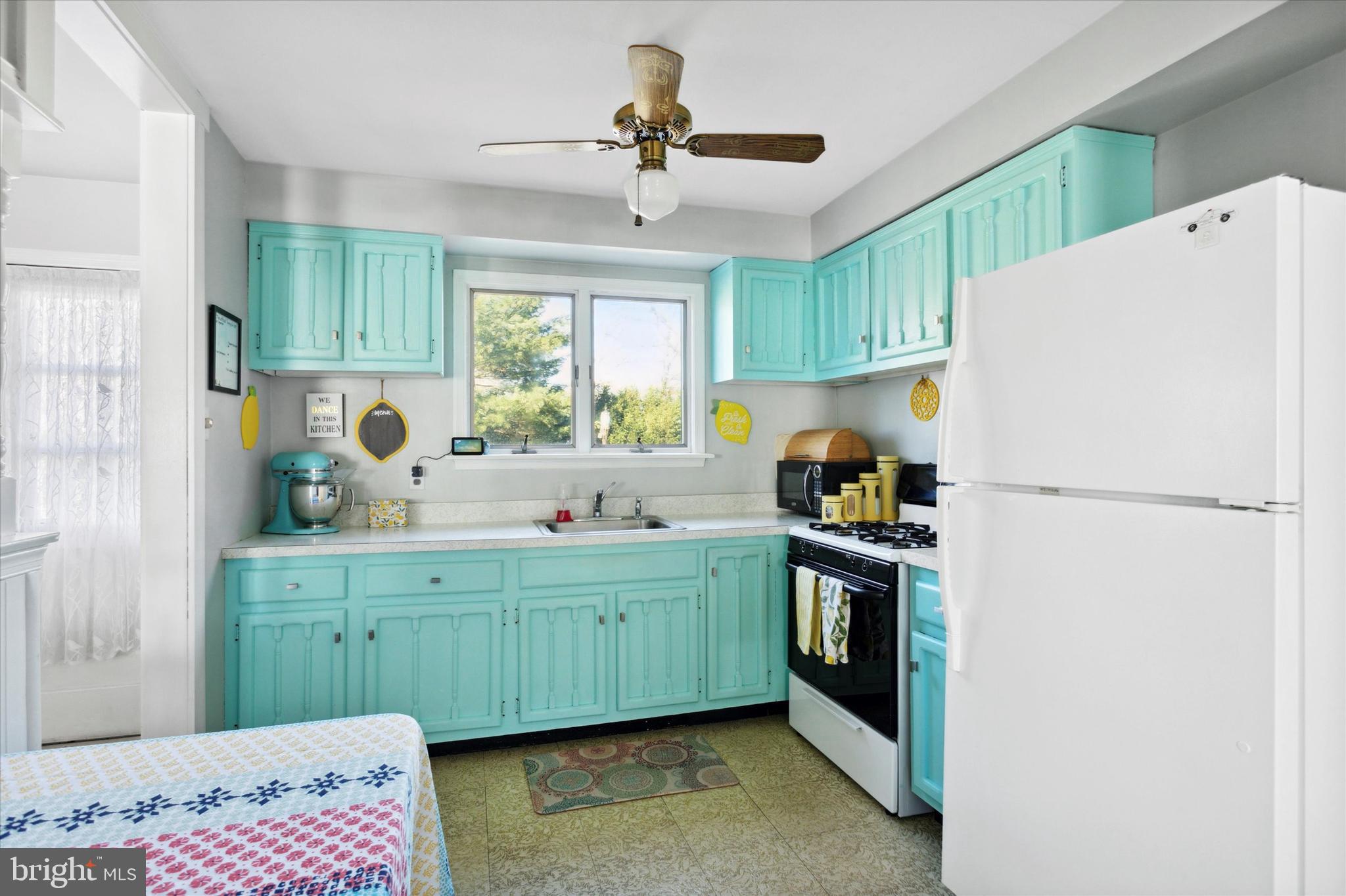 1611 Forest Drive Williamstown, NJ 08094 - Photo 12 of 31 a kitchen with a refrigerator and a sink