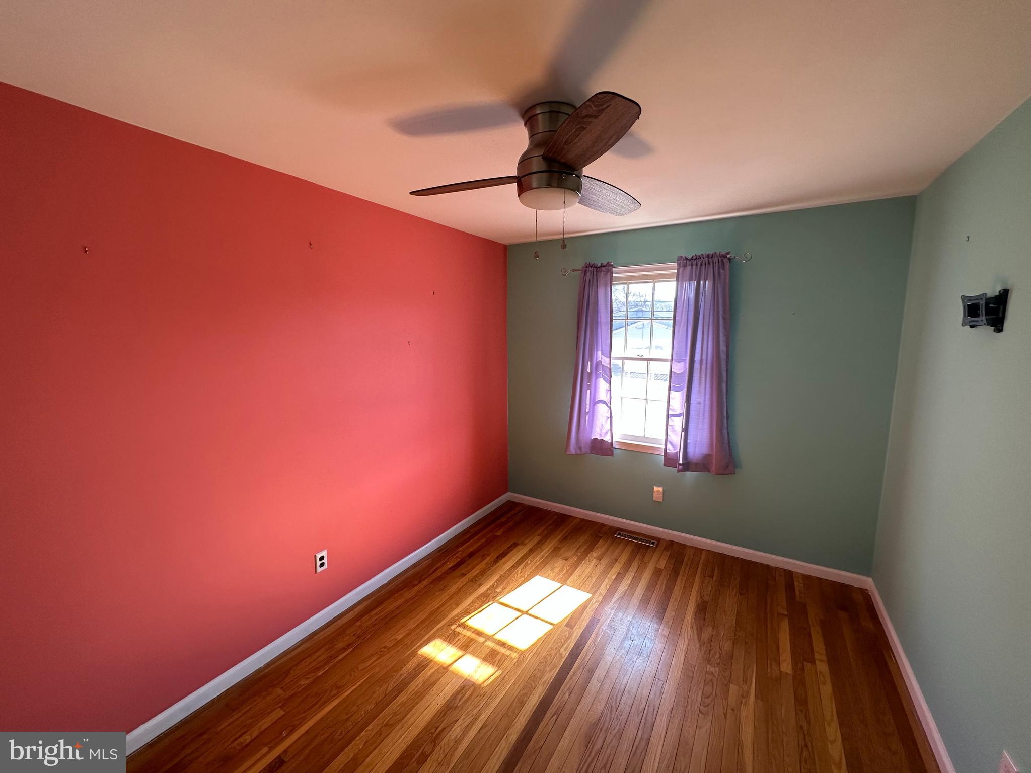 1611 Forest Drive Williamstown, NJ 08094 - Photo 19 of 31 a view of empty room with wooden floor and fan