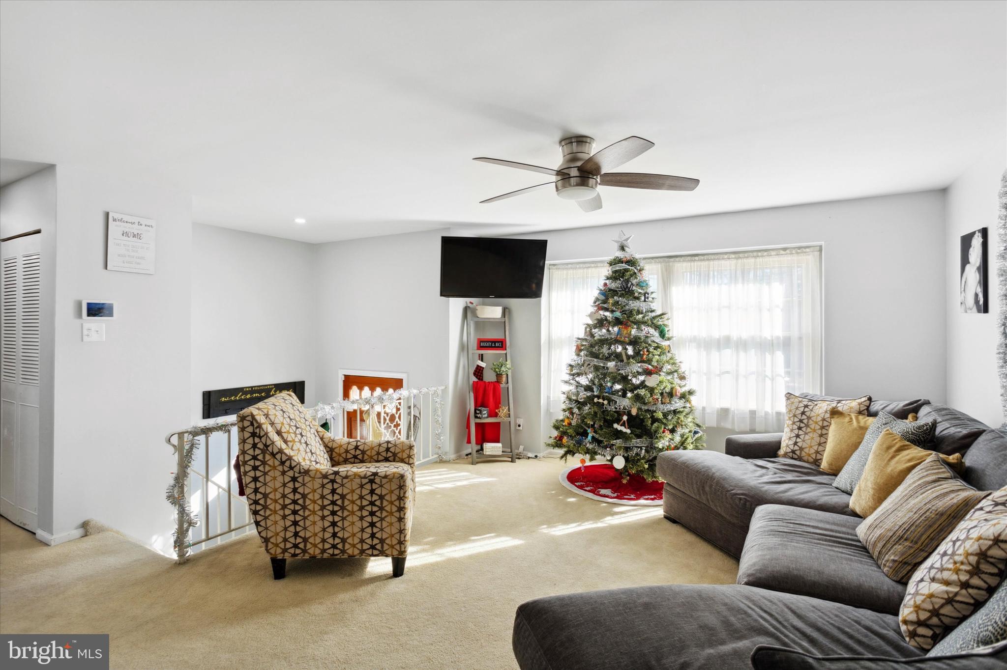 1611 Forest Drive Williamstown, NJ 08094 - Photo 3 of 31 a living room with furniture and a christmas tree