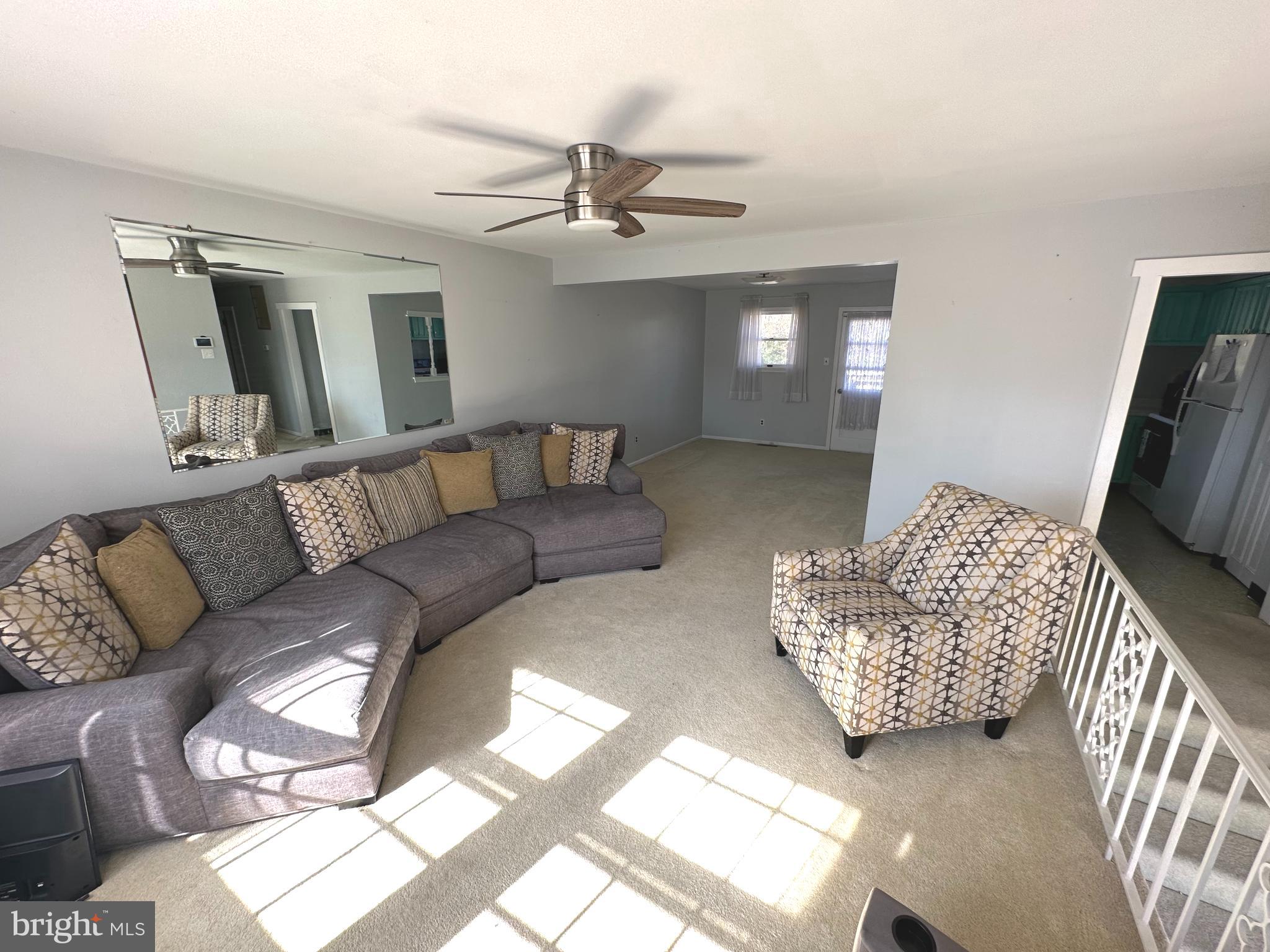 1611 Forest Drive Williamstown, NJ 08094 - Photo 5 of 31 a living room with furniture and a flat screen tv