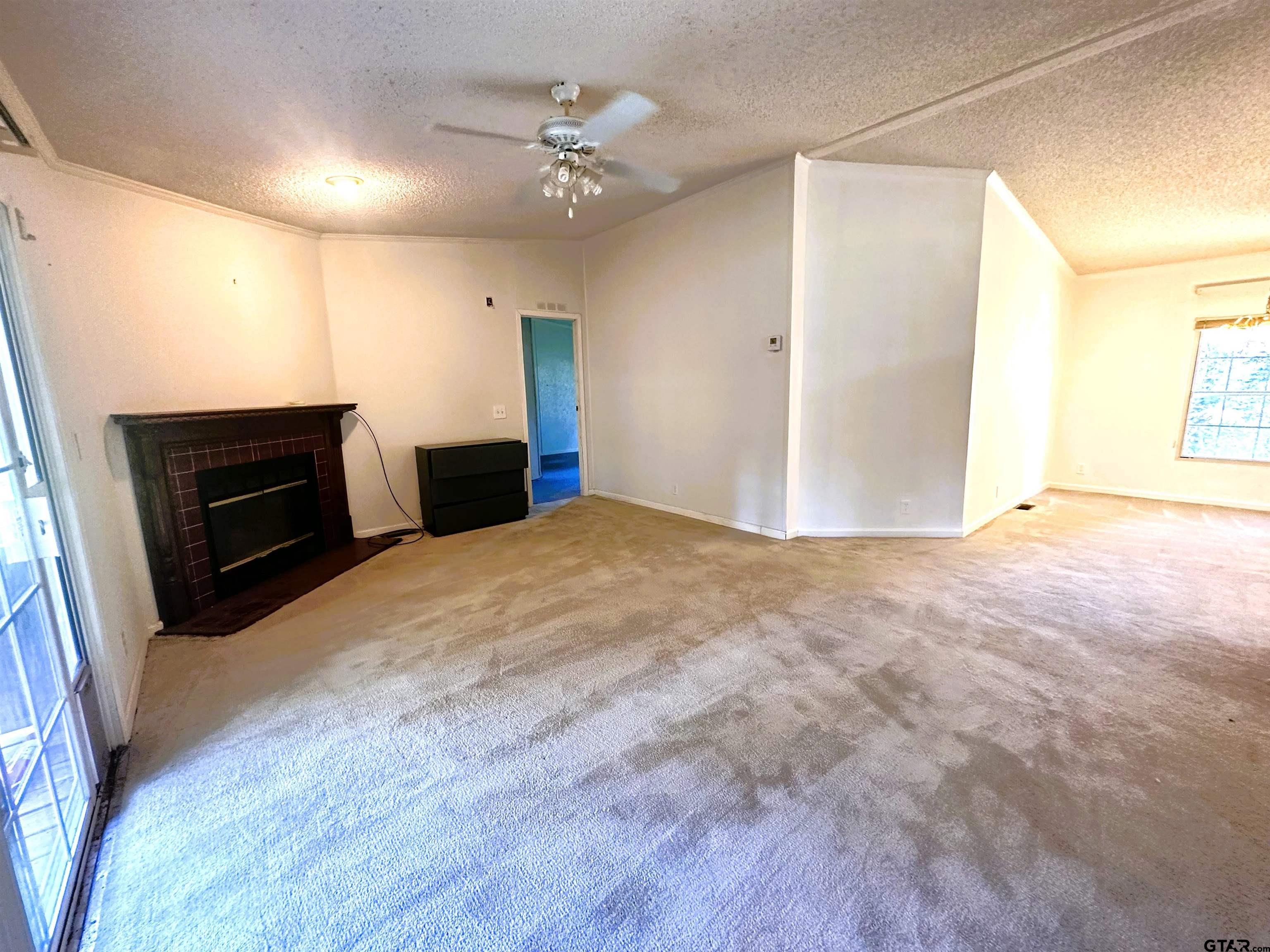 21232 Sand Jack Road Larue, TX 75770 - Photo 12 of 39 a view of a livingroom with a flat screen tv