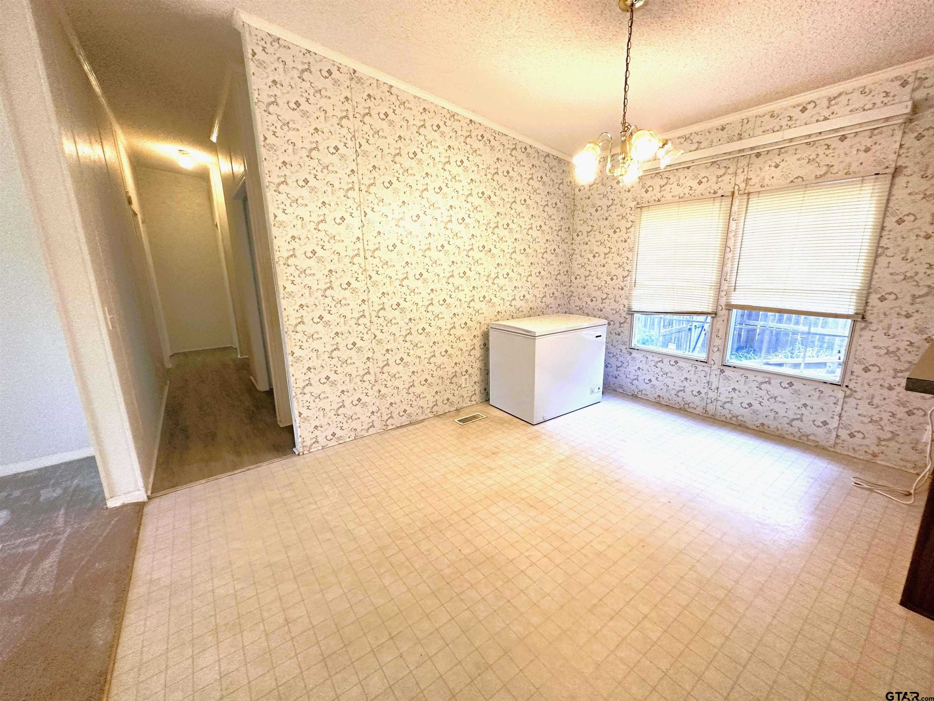 21232 Sand Jack Road Larue, TX 75770 - Photo 21 of 39 a view of a big room with windows and chandelier