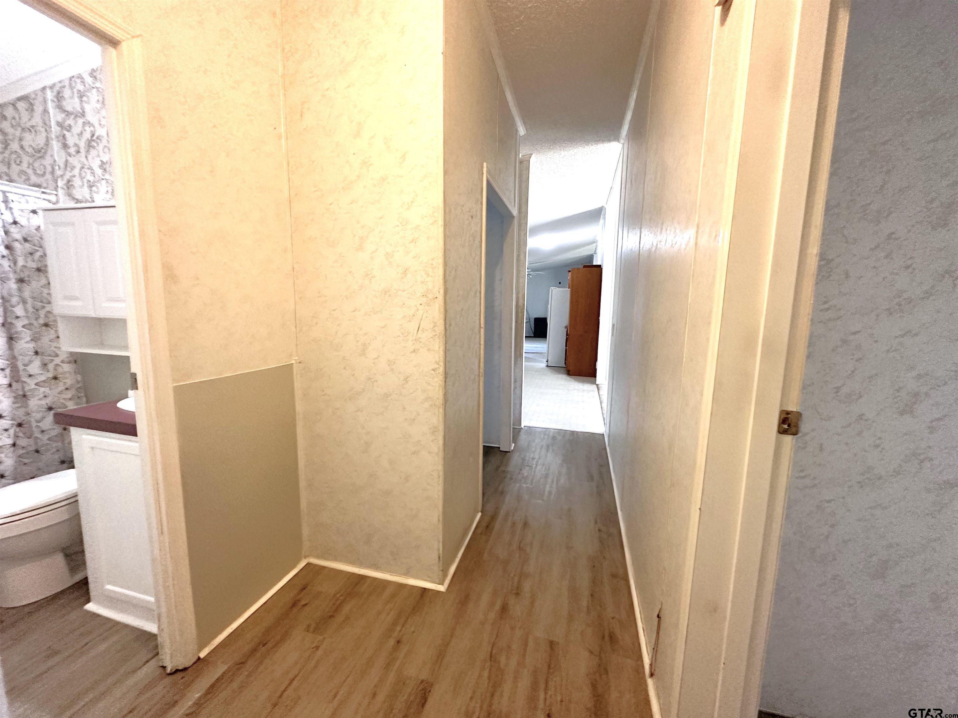 21232 Sand Jack Road Larue, TX 75770 - Photo 26 of 39 a view of a bathroom from a hallway