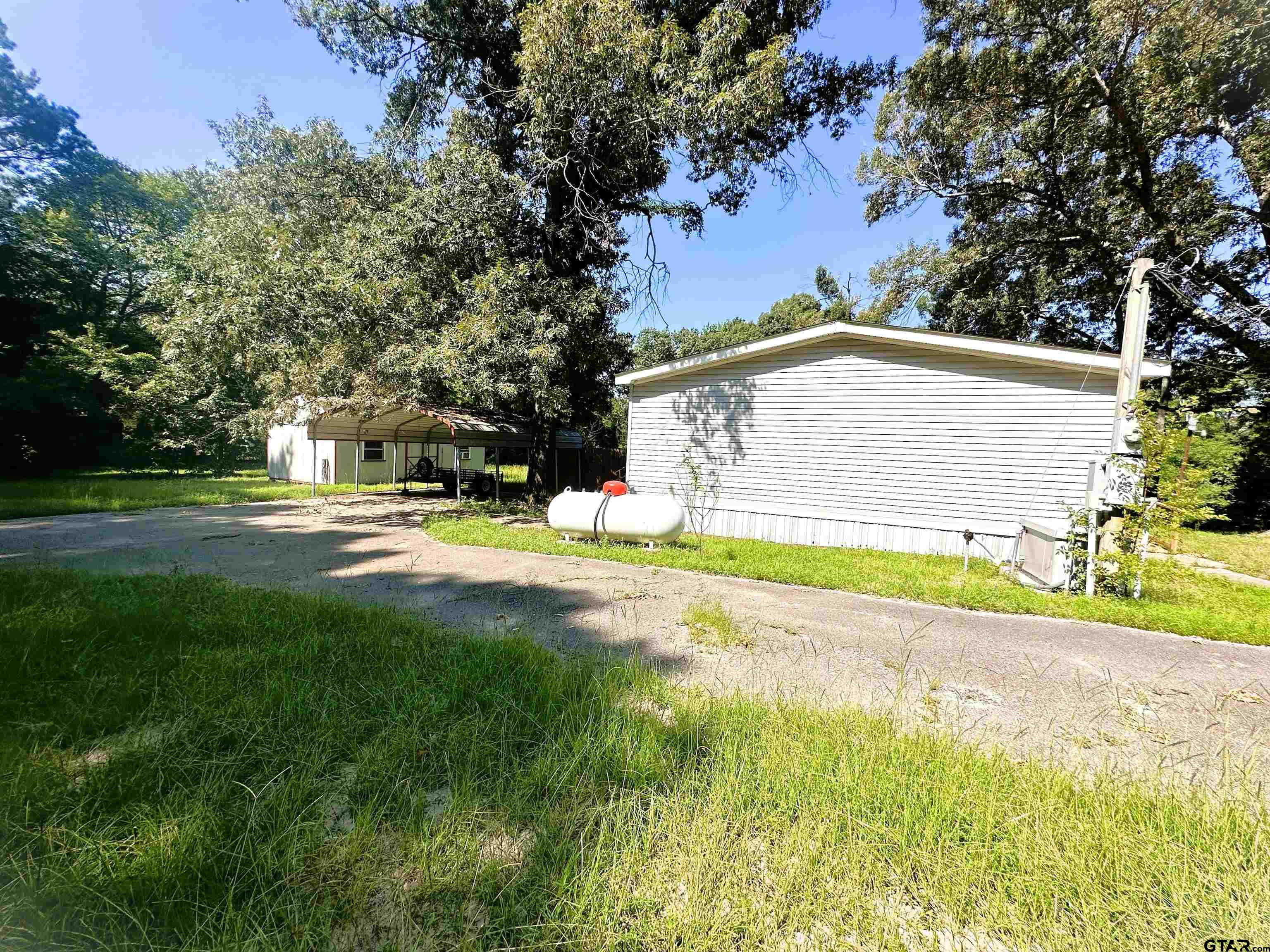 21232 Sand Jack Road Larue, TX 75770 - Photo 33 of 39 a view of the house with a swimming pool