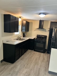 9001 South Cicero Avenue, Unit 134 Oak Lawn, IL 60453 - Photo 2 of 6 a kitchen with a sink and a stove top oven