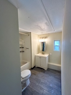 9001 South Cicero Avenue, Unit 134 Oak Lawn, IL 60453 - Photo 5 of 6 a bathroom with a sink a toilet and shower