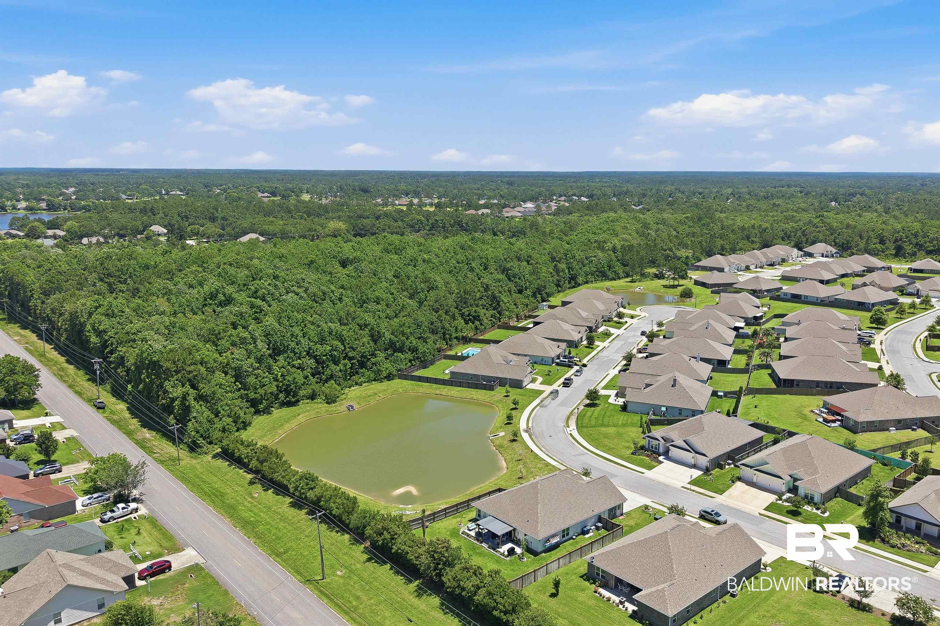 8735 Bronze Lane Foley, AL 36535 - Photo 57 of 58 Aerial perspective showcasing a residential community with numerous single-story homes