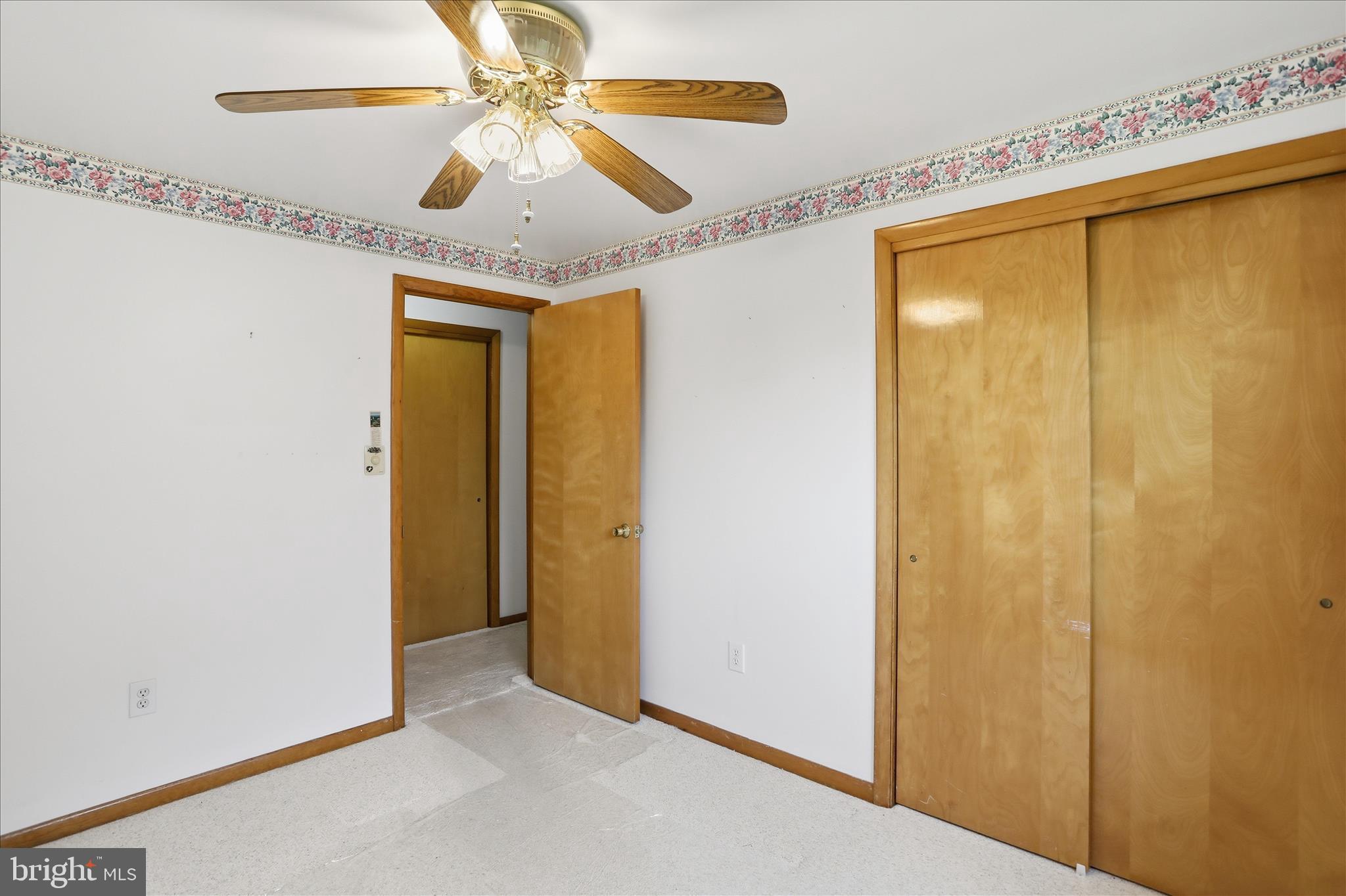 199 Buser Street Ridgeley, WV 26753 - Photo 20 of 49 a view of a livingroom with a ceiling fan and a chandelier fan