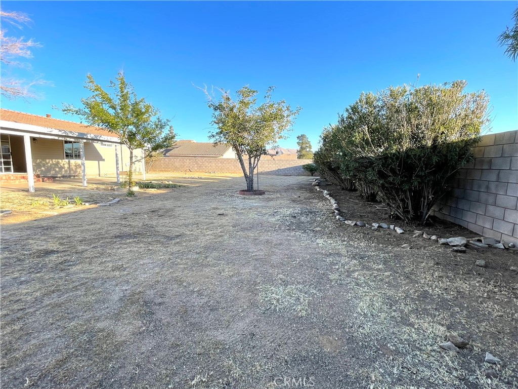 12546 Navajo Road Apple Valley, CA 92308 - Photo 15 of 27 Large yard with block wall fencing.