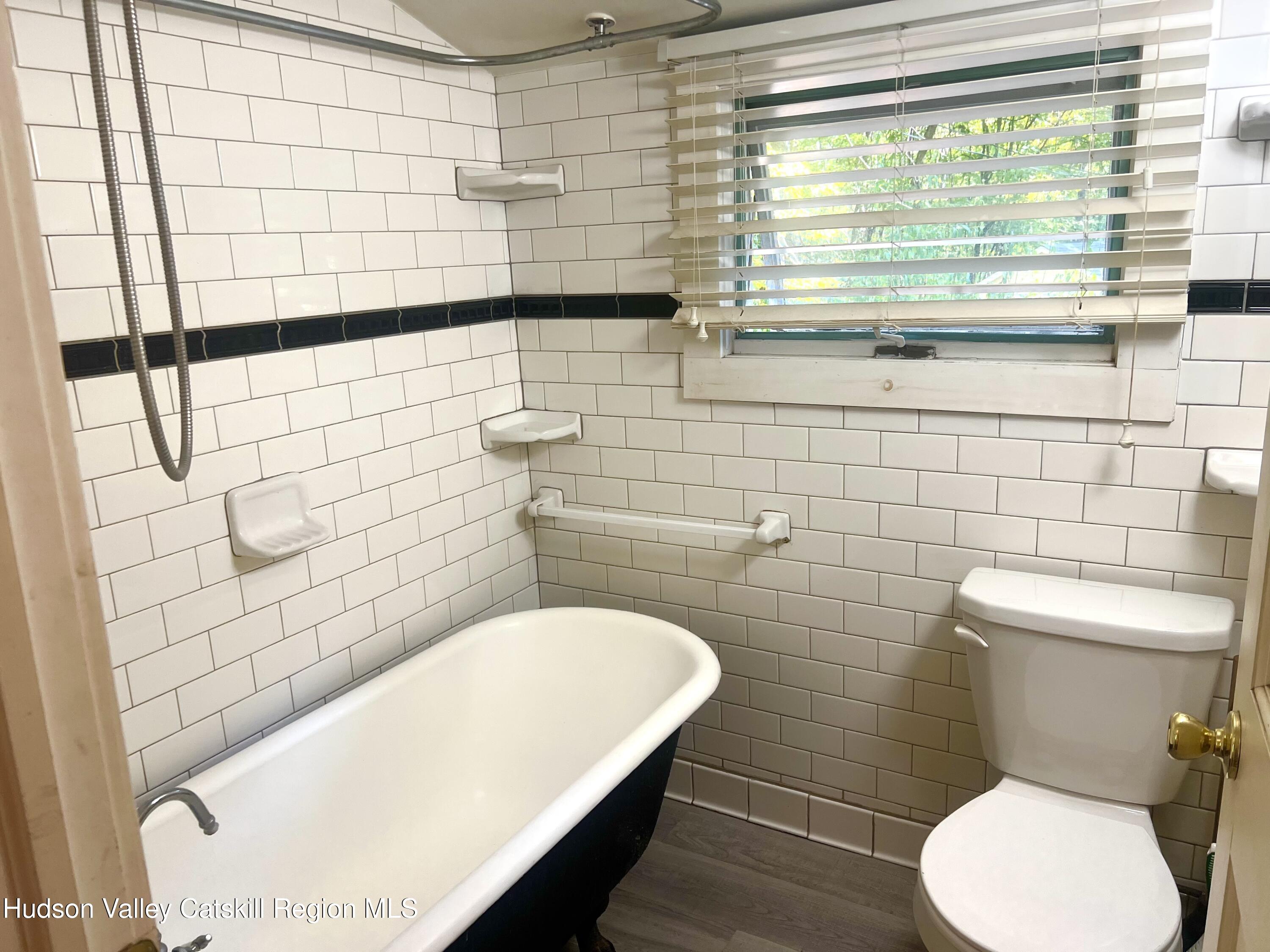 57 Ohayo Mountain Road Woodstock, NY 12498 - Photo 12 of 14 a bathroom with a toilet and a shower