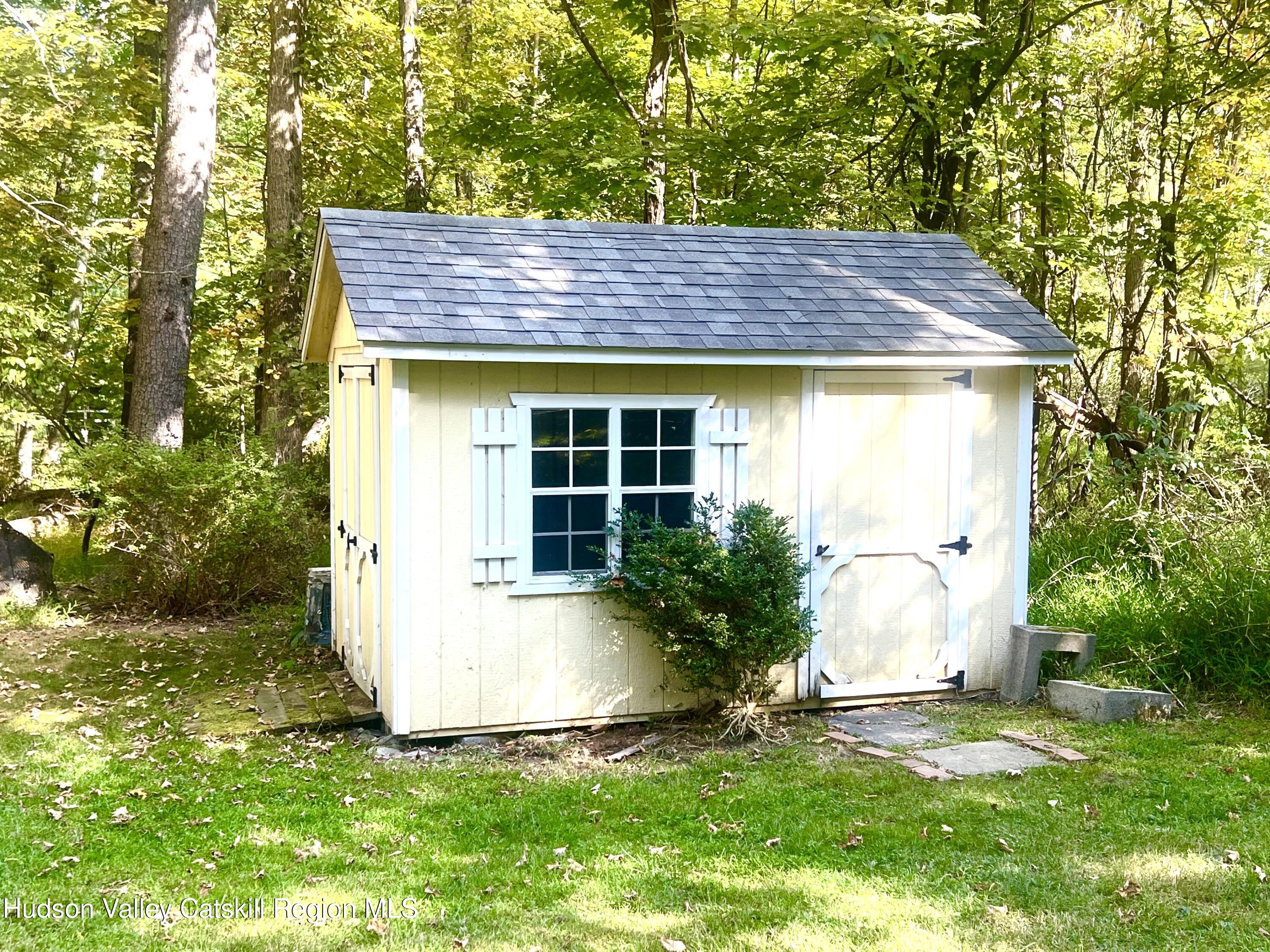 57 Ohayo Mountain Road Woodstock, NY 12498 - Photo 14 of 14 a house view with a garden space