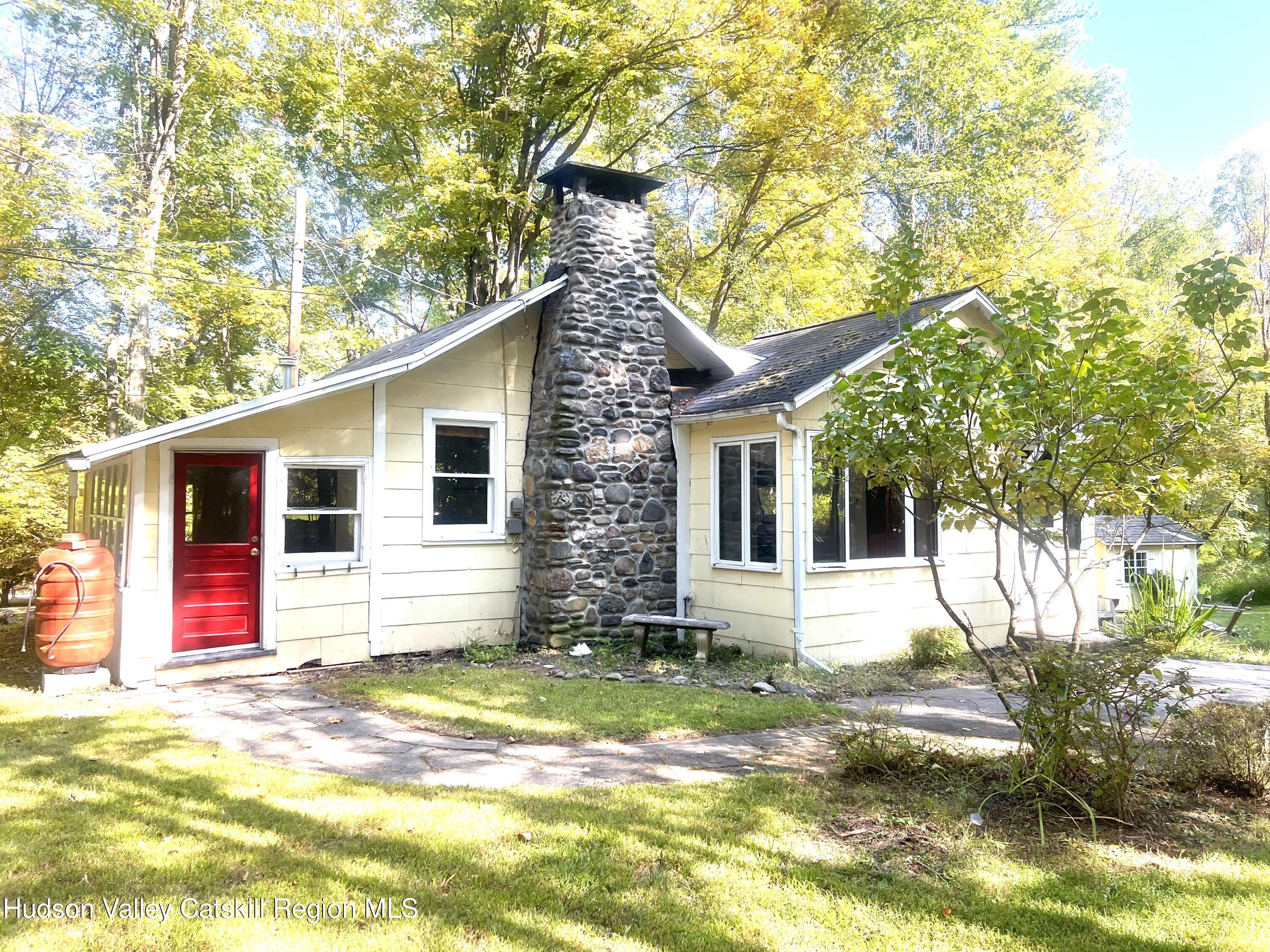 57 Ohayo Mountain Road Woodstock, NY 12498 - Photo 2 of 14 a view of a backyard of the house