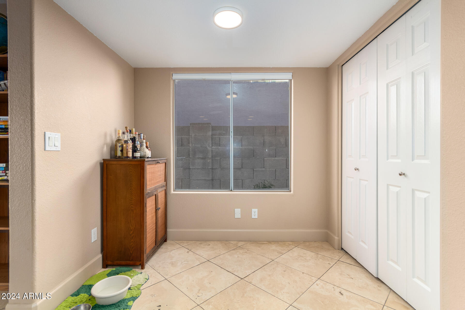 1836 North Stapley Drive, Unit 102 Mesa, AZ 85203 - Photo 17 of 34 an empty room with windows and closet