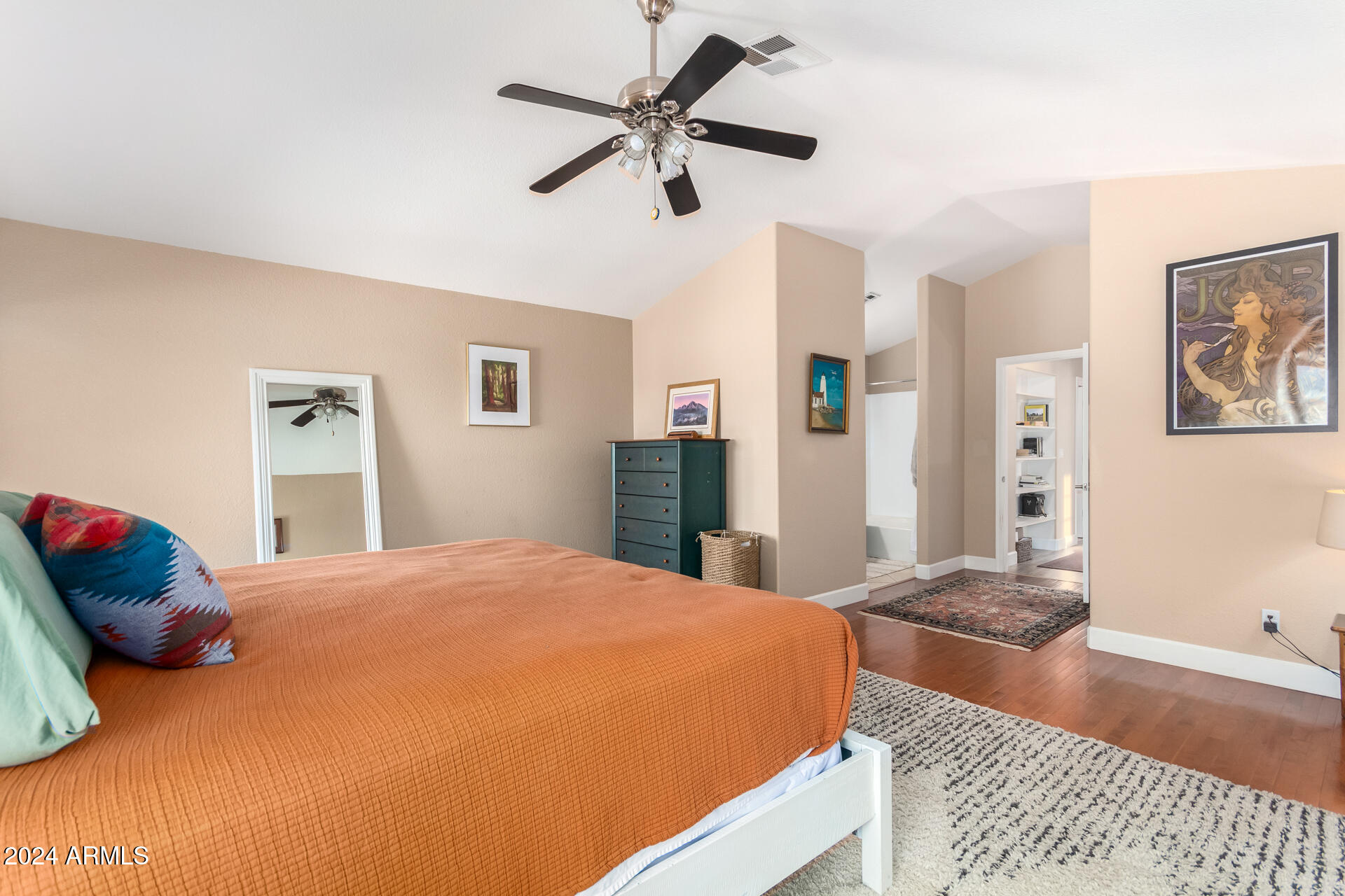 1836 North Stapley Drive, Unit 102 Mesa, AZ 85203 - Photo 21 of 34 a bedroom with a bed and a chandelier