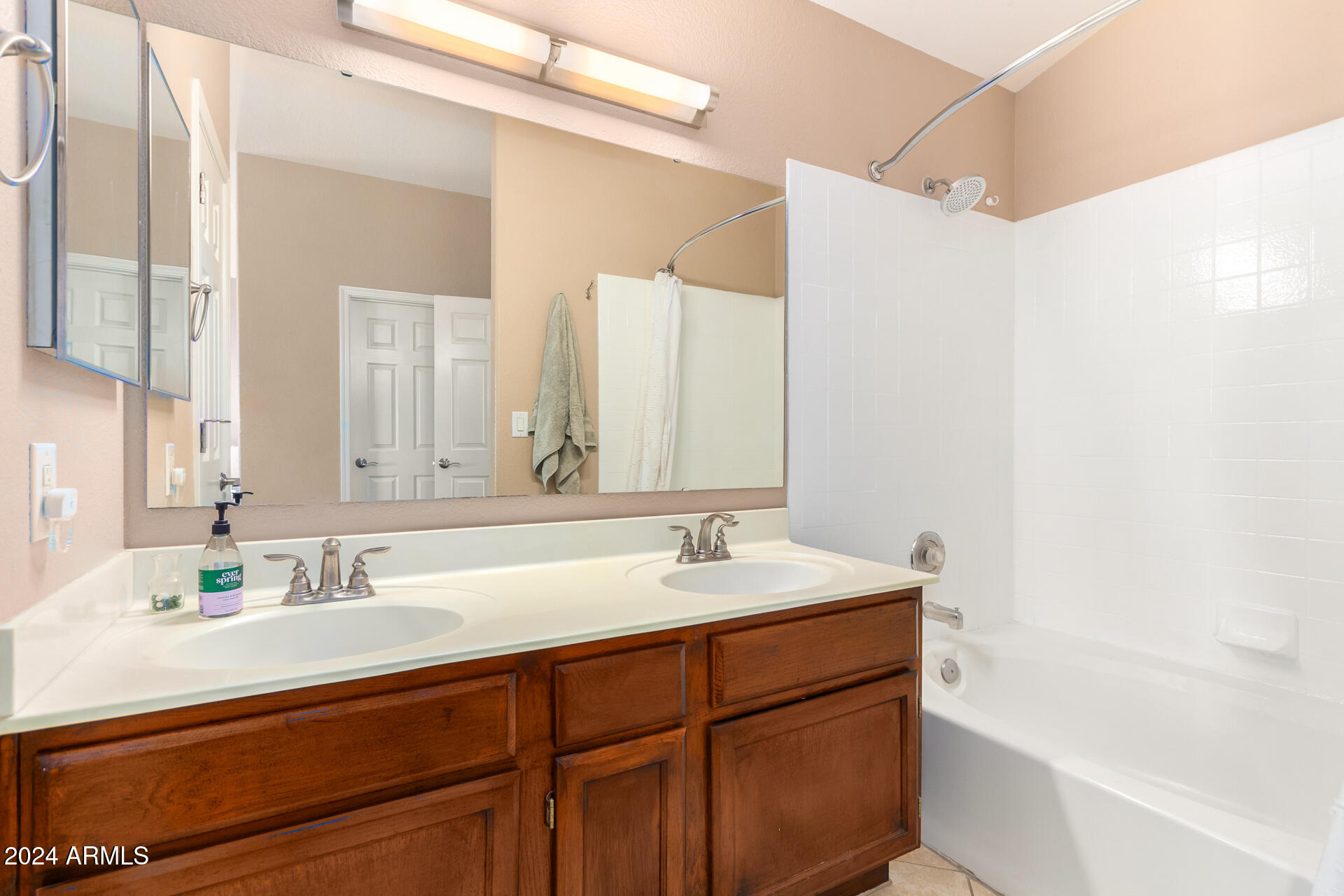 1836 North Stapley Drive, Unit 102 Mesa, AZ 85203 - Photo 23 of 34 a bathroom with a sink and a mirror
