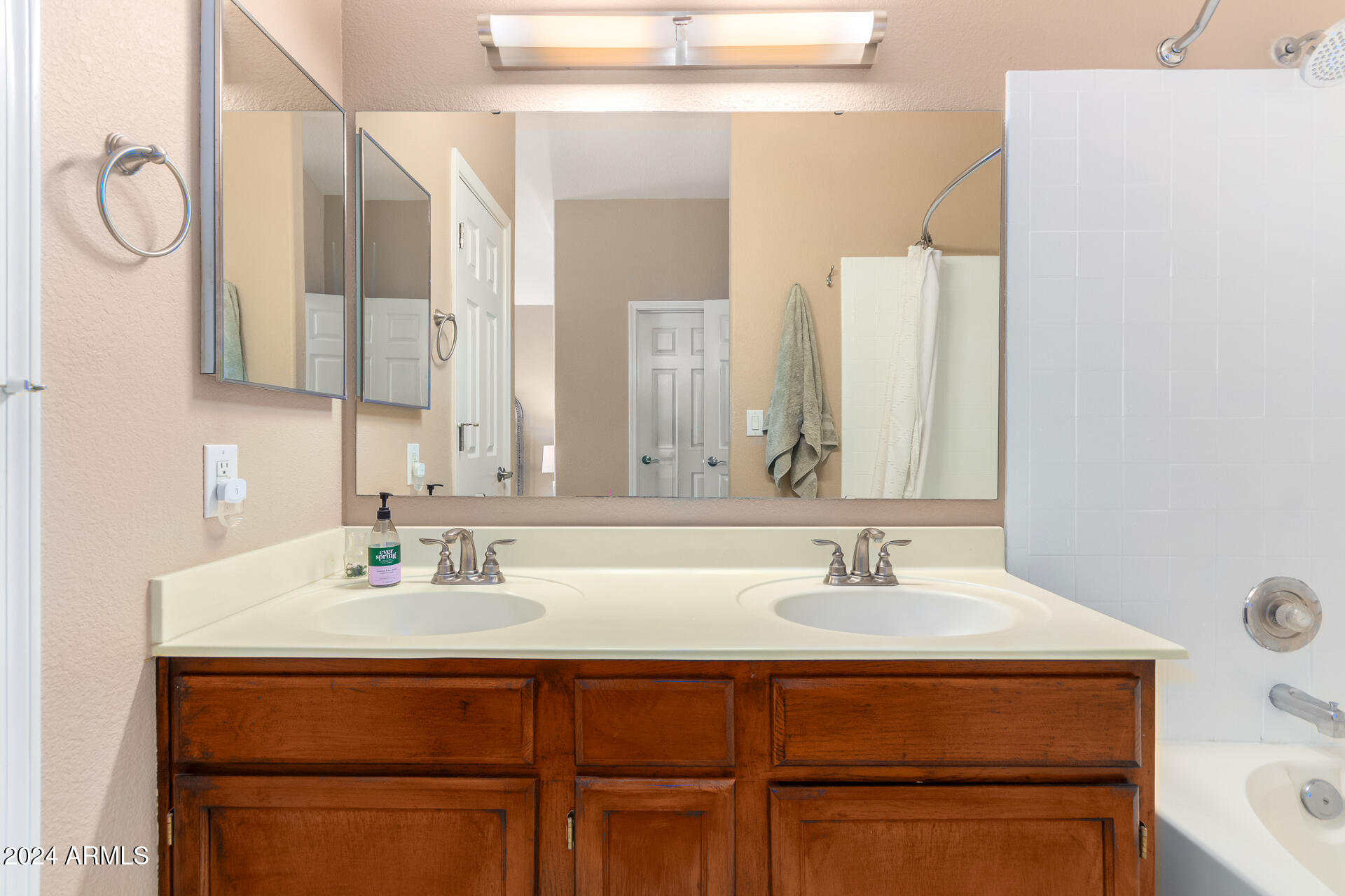 1836 North Stapley Drive, Unit 102 Mesa, AZ 85203 - Photo 24 of 34 a bathroom with a sink and a mirror