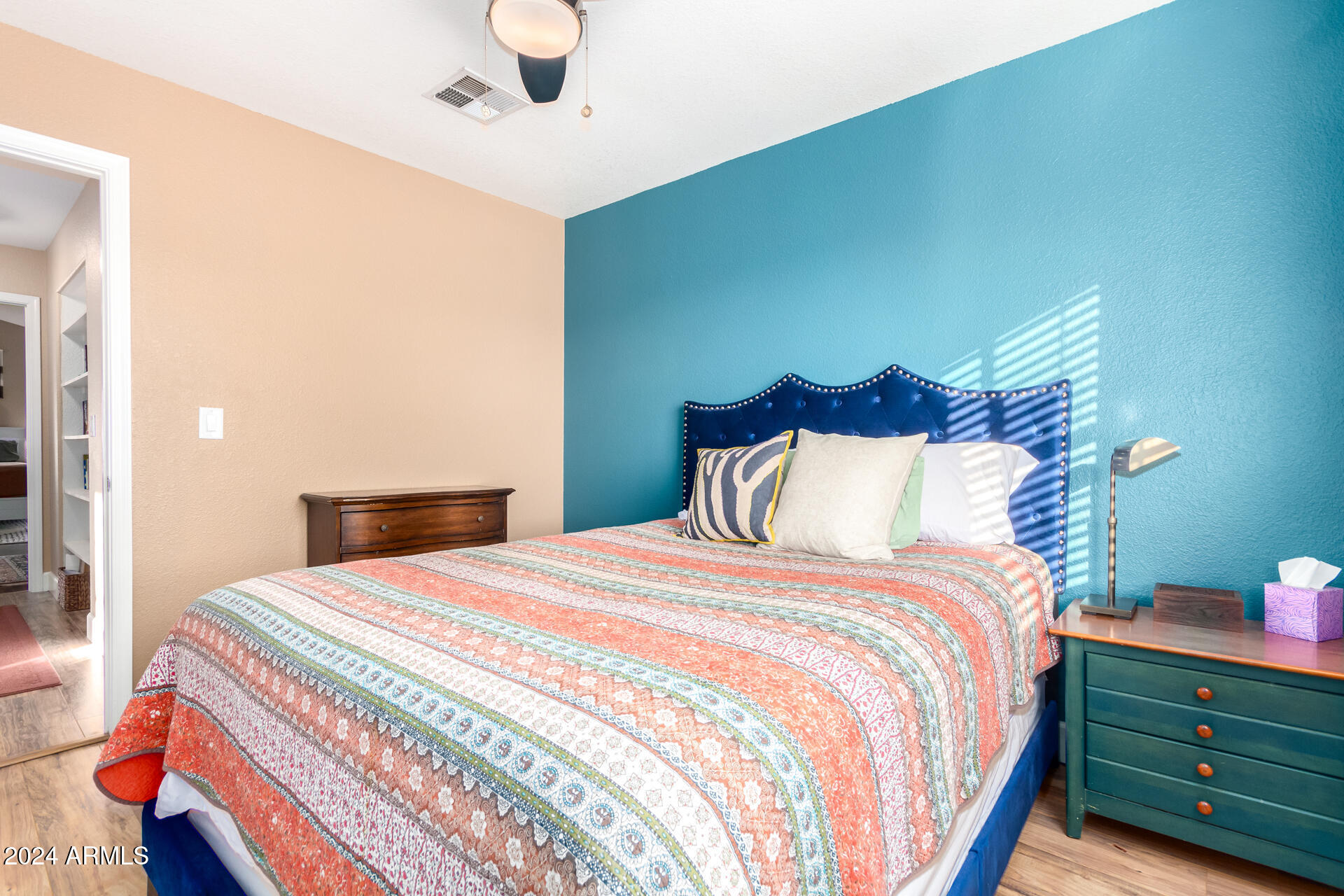 1836 North Stapley Drive, Unit 102 Mesa, AZ 85203 - Photo 26 of 34 a bedroom with a bed and a night stand