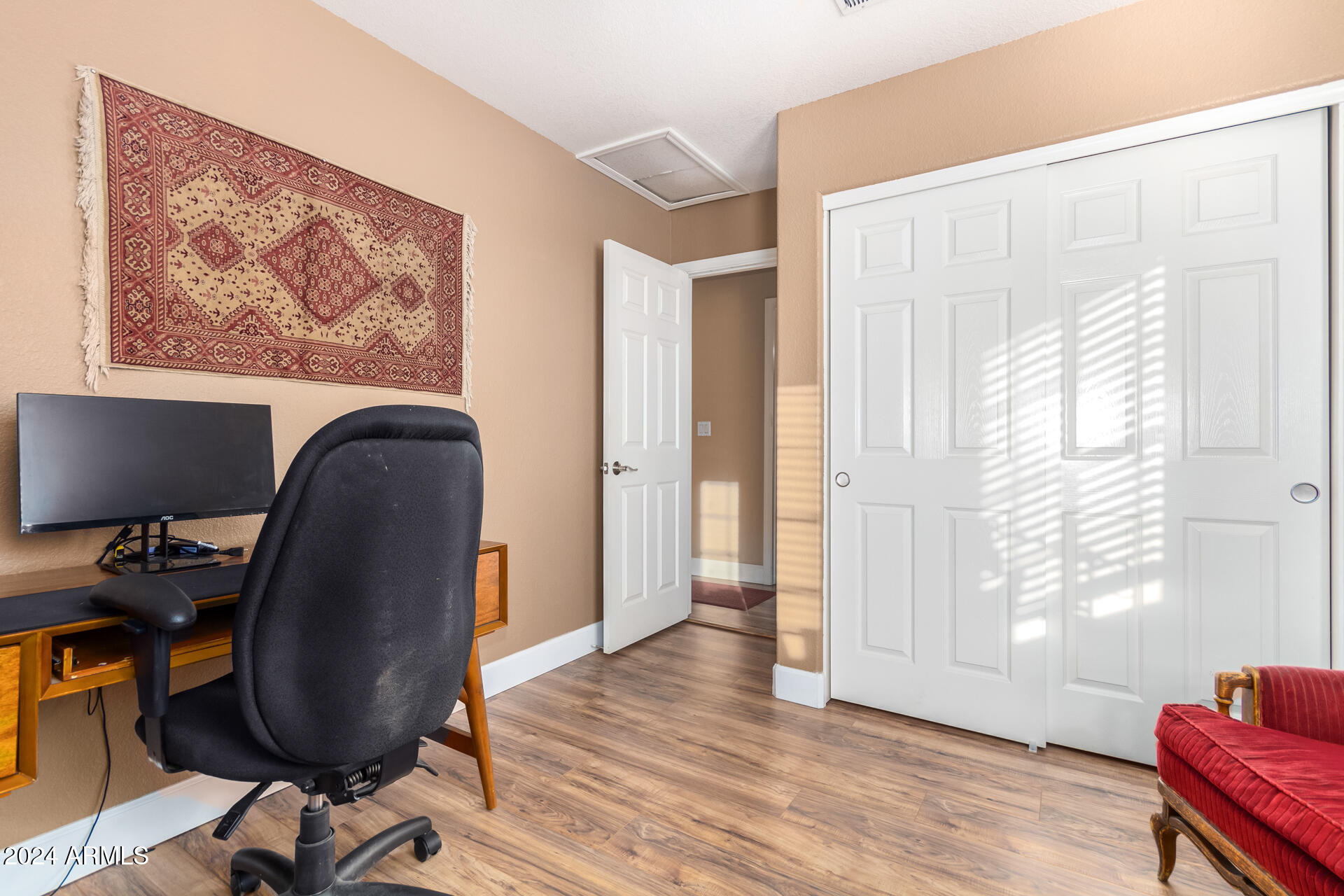 1836 North Stapley Drive, Unit 102 Mesa, AZ 85203 - Photo 29 of 34 a view of workspace with wooden floor and windows