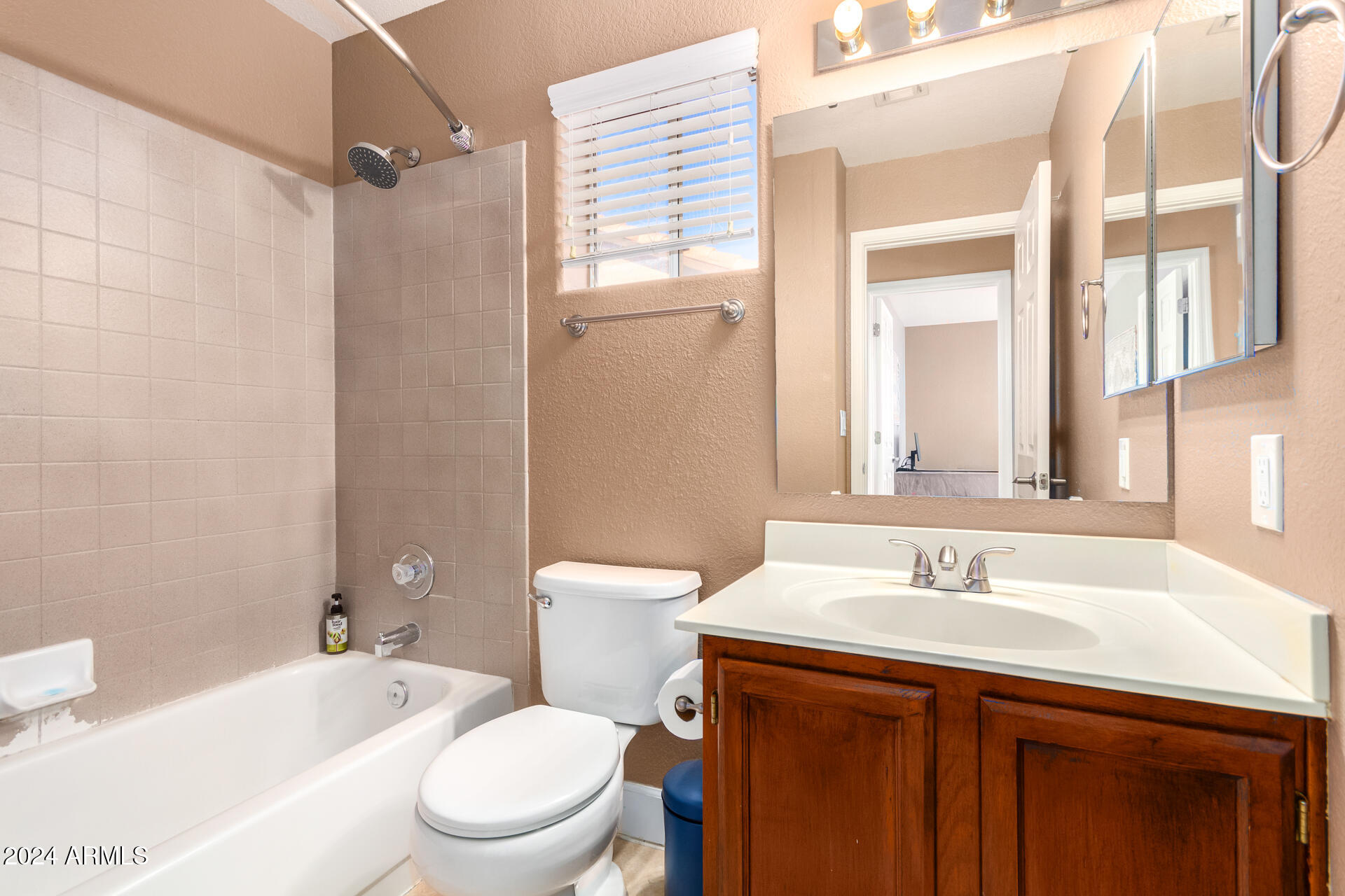 1836 North Stapley Drive, Unit 102 Mesa, AZ 85203 - Photo 30 of 34 a bathroom with a sink a toilet and shower
