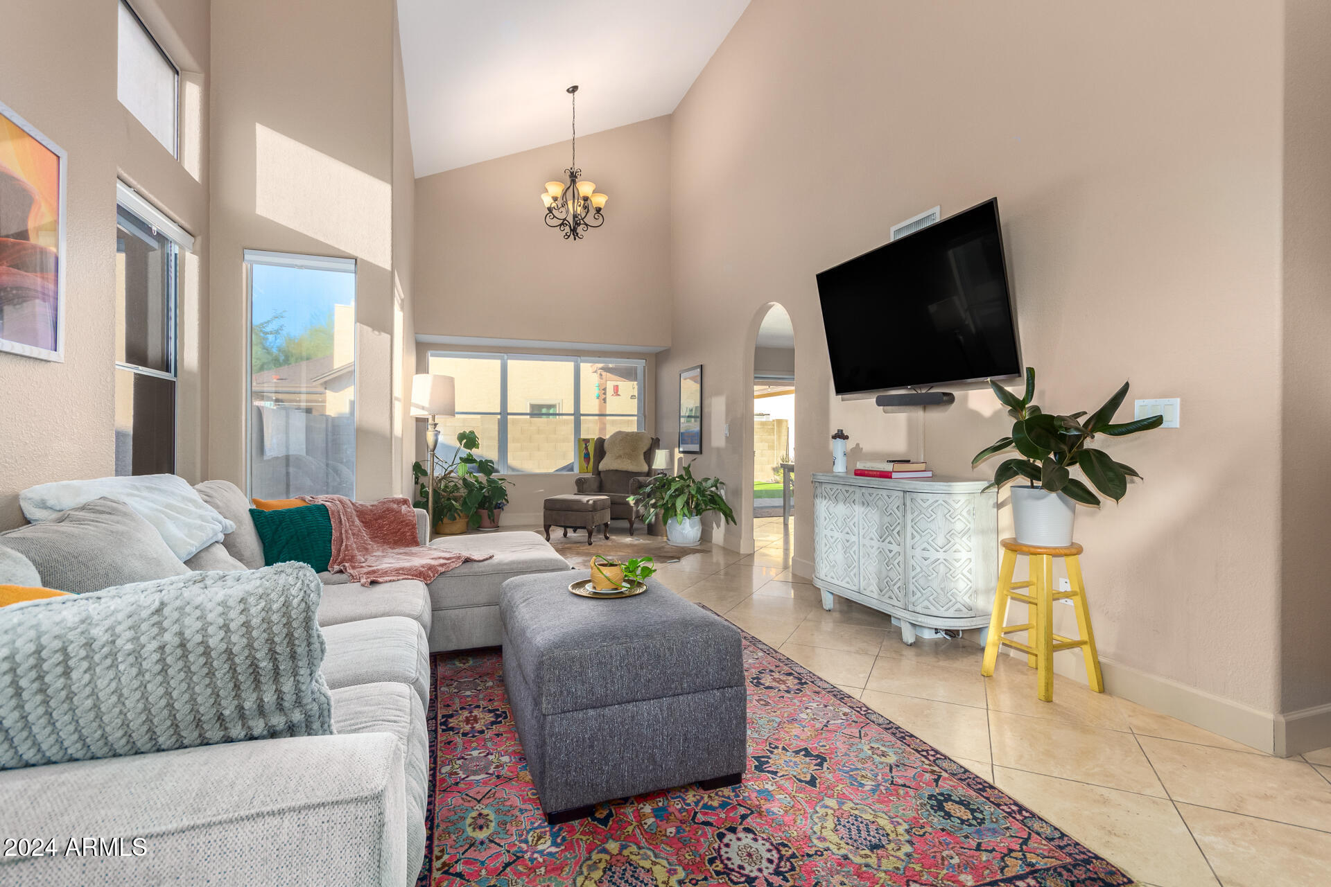1836 North Stapley Drive, Unit 102 Mesa, AZ 85203 - Photo 5 of 34 a living room with furniture and a flat screen tv