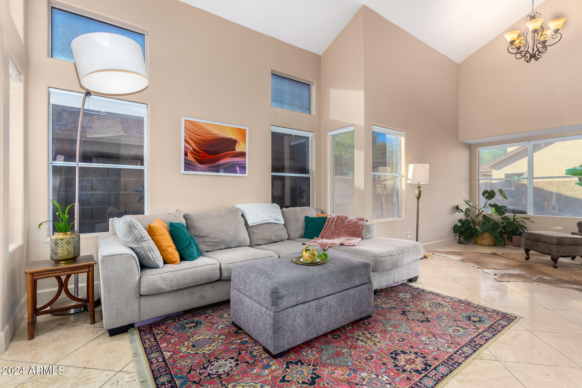 1836 North Stapley Drive, Unit 102 Mesa, AZ 85203 - Photo 6 of 34 a living room with furniture and a rug