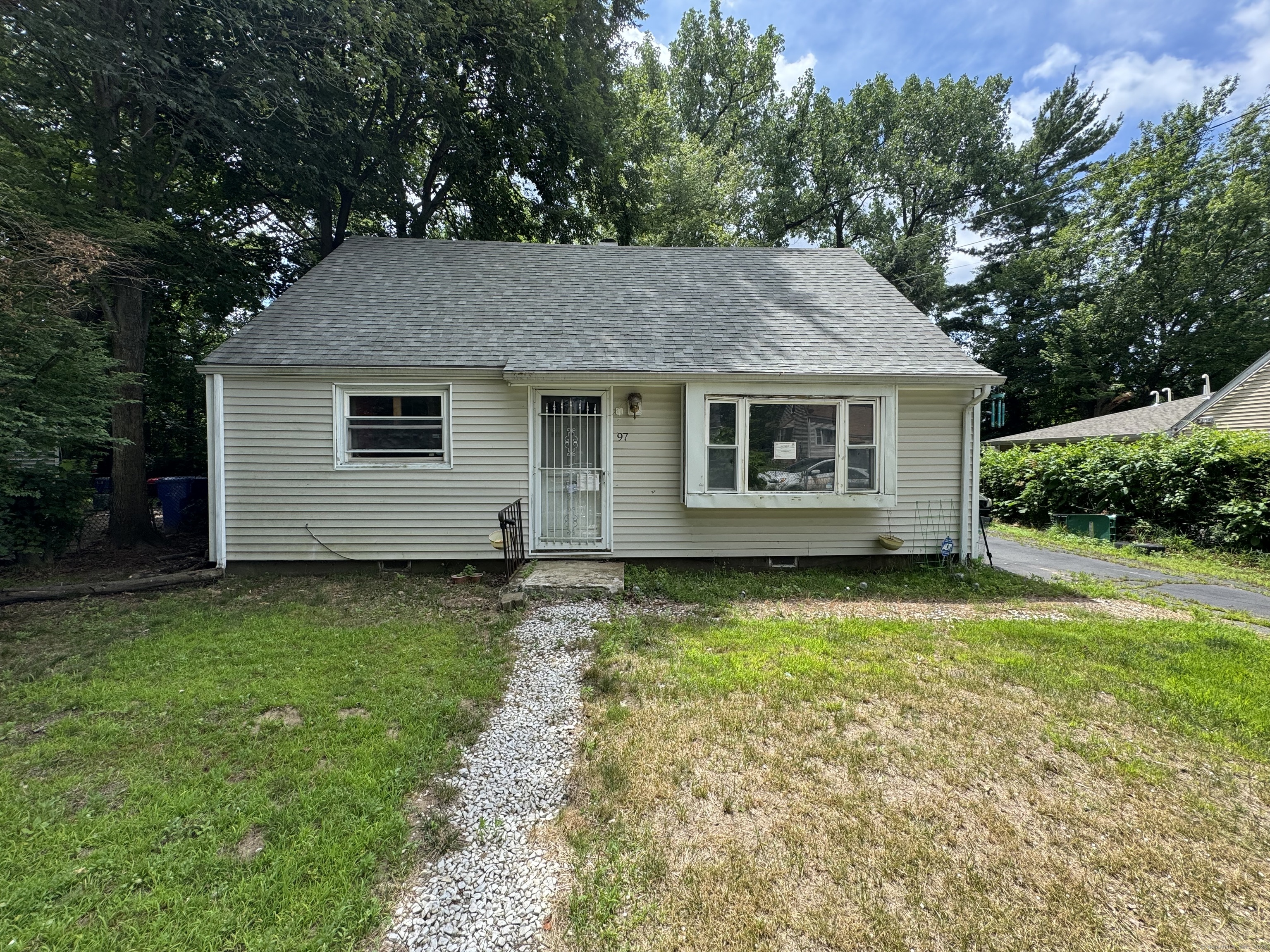 97 East Burnham Street Bloomfield, CT 06002 - Photo 1 of 7 a view of a house with a yard
