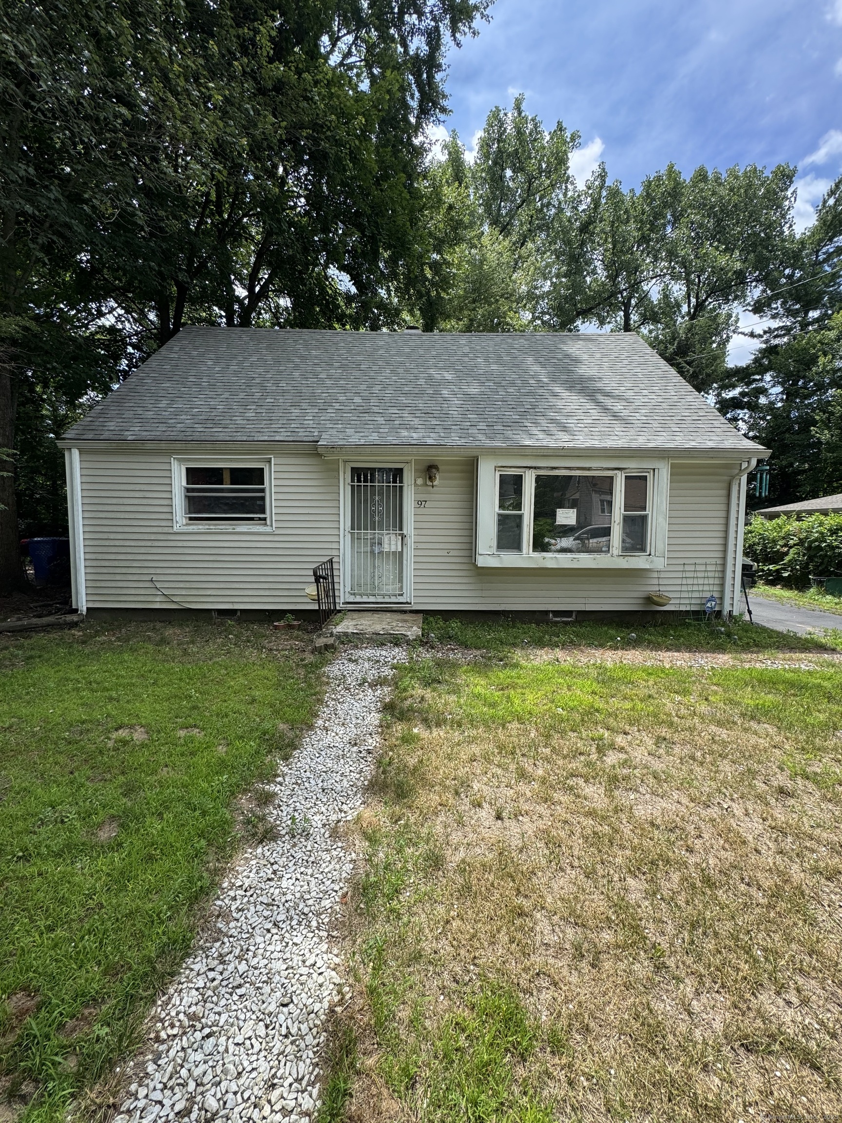 97 East Burnham Street Bloomfield, CT 06002 - Photo 4 of 7 a house view with a garden space