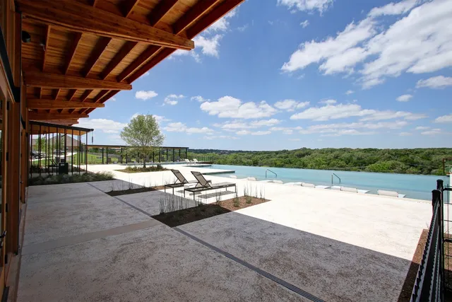 a view of a swimming pool with an outdoor seating