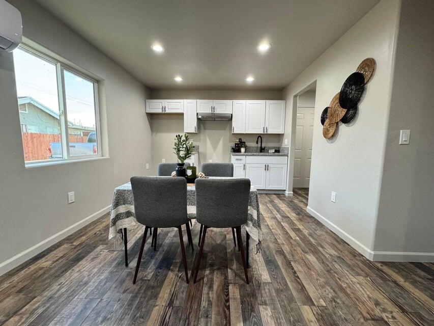 177 South Callison Road Tipton, CA 93272 - Photo 6 of 18 a kitchen with a dining table chairs and refrigerator