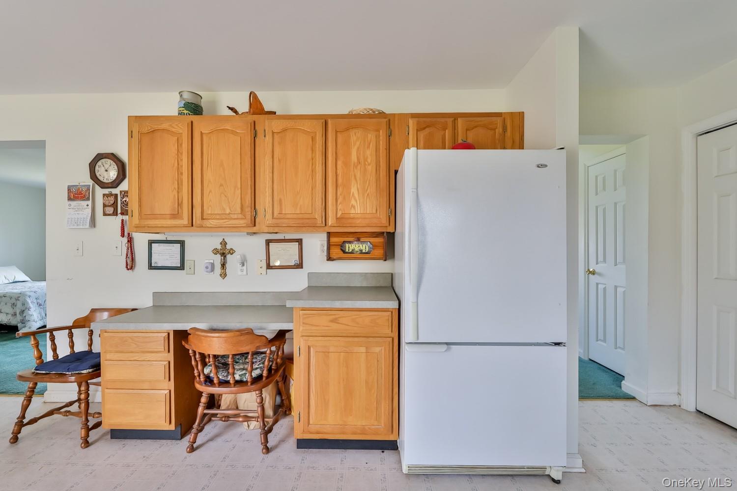 559 Case Road Ashland, NY 12496 - Photo 11 of 33 a kitchen with a refrigerator a table and chairs in it