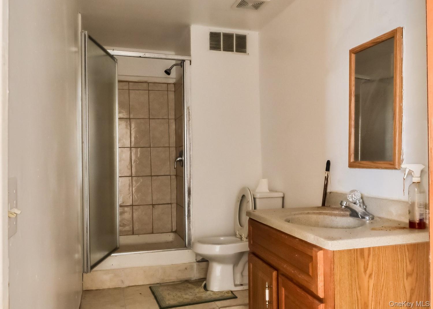 559 Case Road Ashland, NY 12496 - Photo 25 of 33 a bathroom with a granite countertop sink toilet and shower