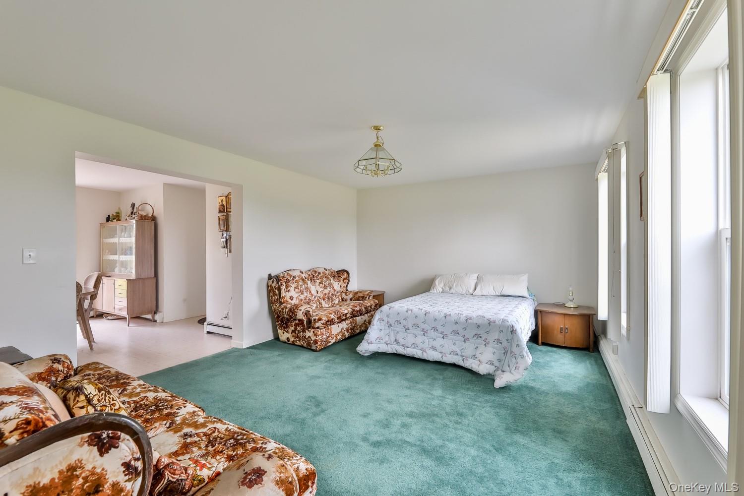 559 Case Road Ashland, NY 12496 - Photo 8 of 33 a bed room with a bed and a chair