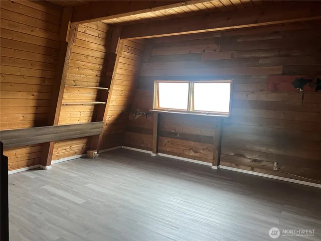 a view of an empty room with a fireplace