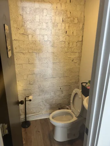 a bathroom with a toilet and a sink