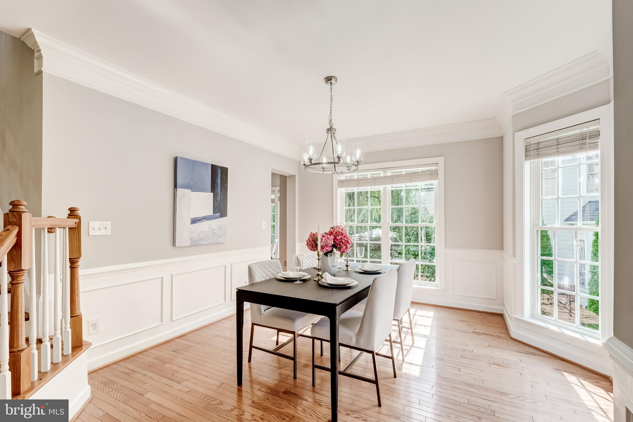 19111 Chartier Drive Leesburg, VA 20176 - Photo 11 of 68 a view of a dining room with furniture window and wooden floor